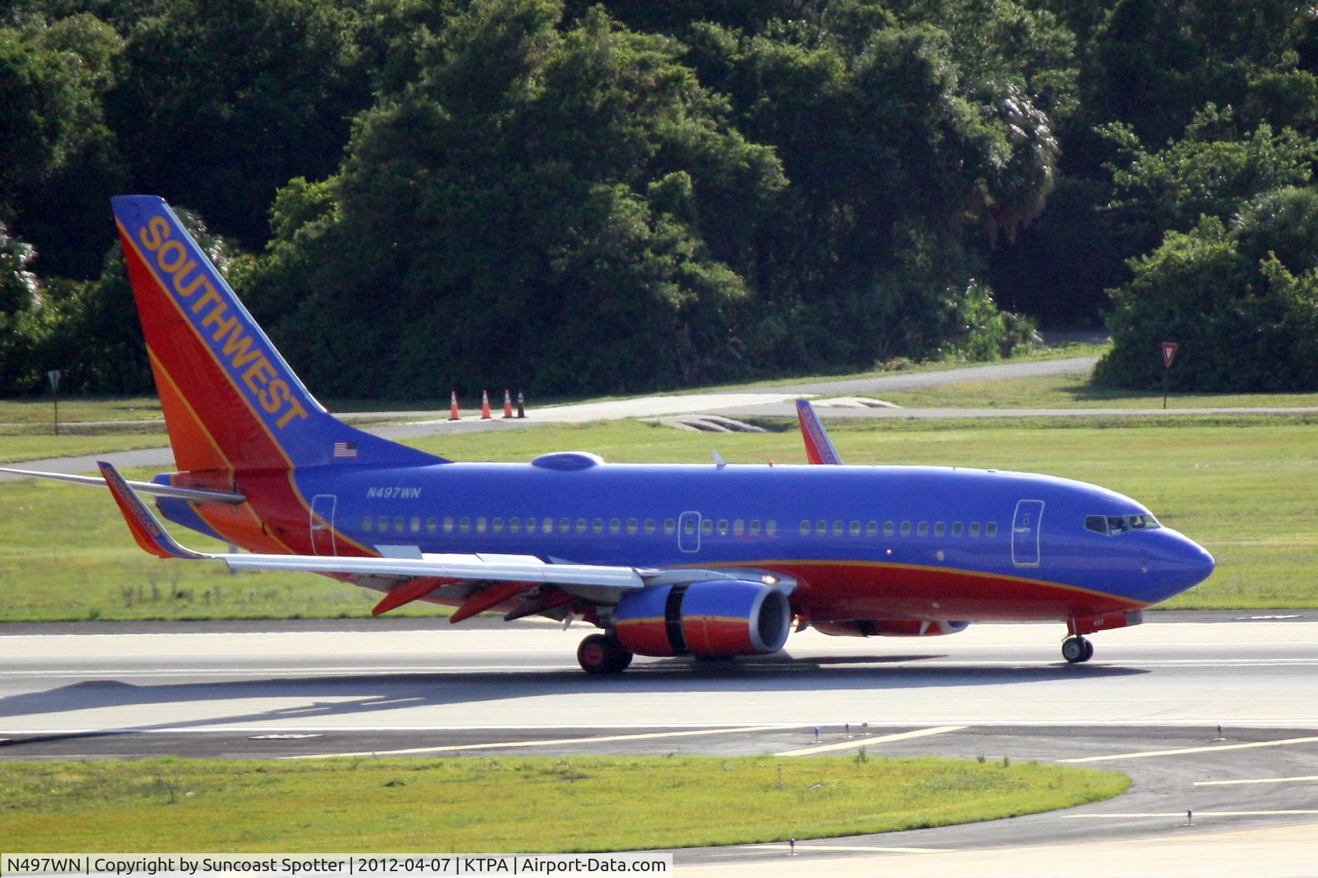 N497WN, 2004 Boeing 737-7H4 C/N 32479, Southwest Flight 2213 arrives on Runway 1L at Tampa International Airport following a flight from Denver International Airport