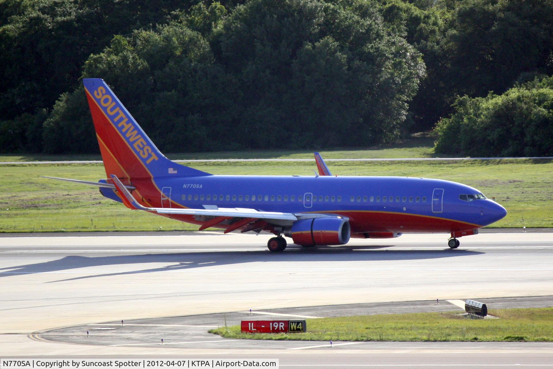 N770SA, 2000 Boeing 737-7H4 C/N 30589, Southwest Flight 2459 arrives on Runway 1L at Tampa International Airport following a flight from Green State Airport