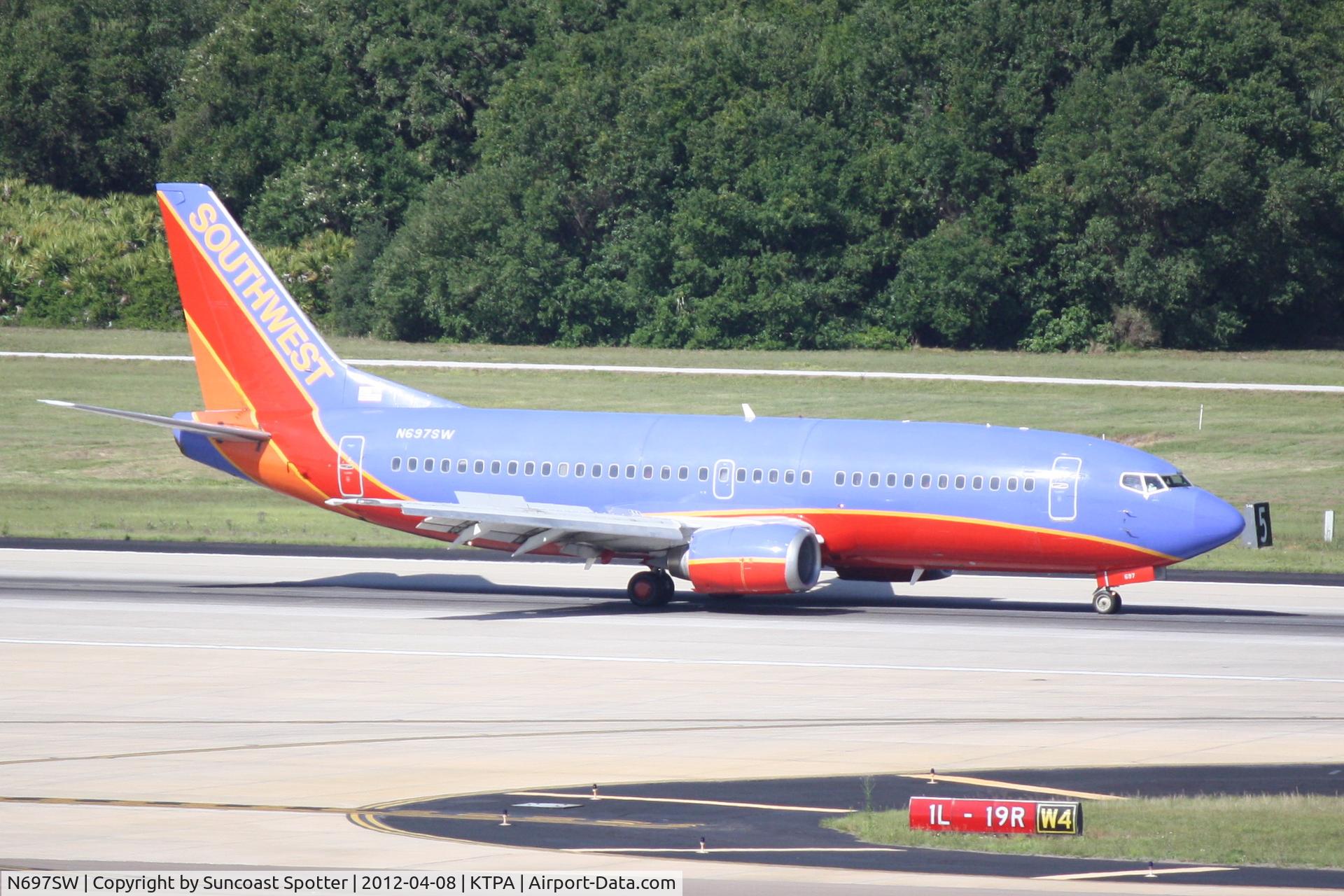 N697SW, 1988 Boeing 737-3TO C/N 23838, Southwest Flight 3057 arrives on Runway 1L at Tampa International Airport following a flight from Chicago-Midway International Airport