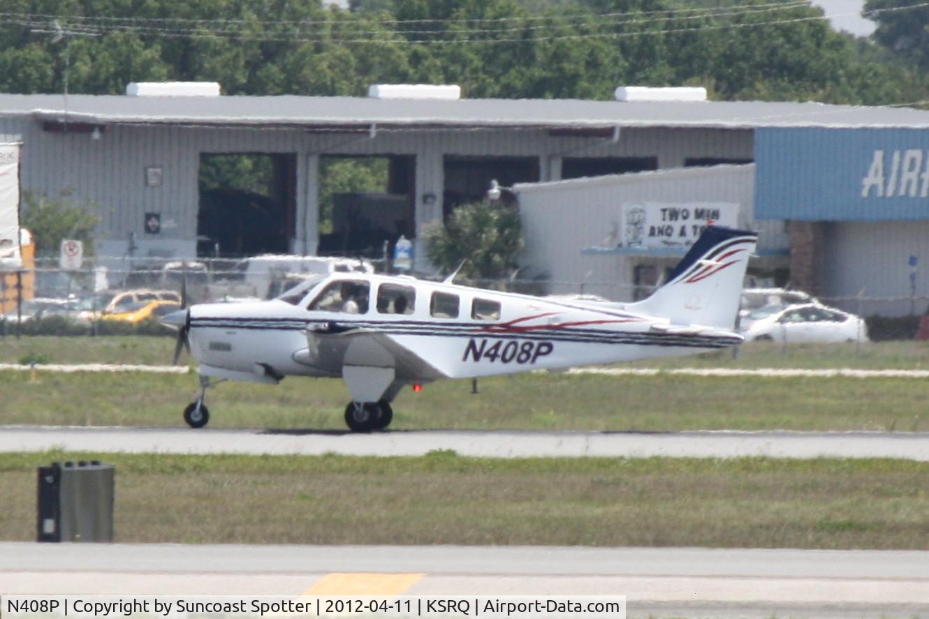 N408P, 2004 Raytheon Aircraft Company A36 Bonanza C/N E-3580, N408P departs Runway 32 at Sarasota-Bradenton International Airport enroute to Tampa Executive Airport