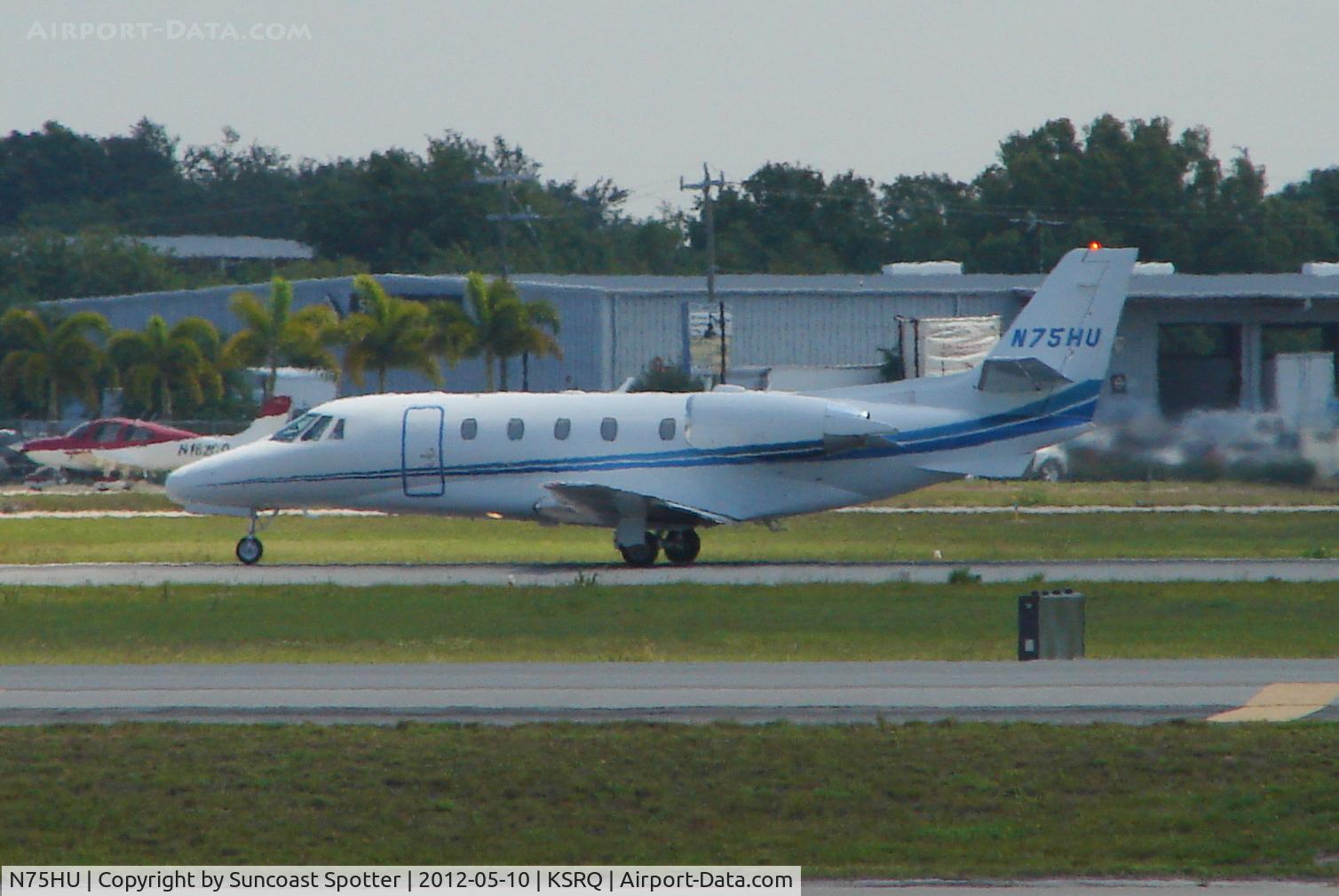 N75HU, 2000 Cessna 560XL C/N 560-5119, Elite Jet Flight 75 departs Runway 32 at Sarasota-Bradenton International Airport enroute to Montreal-Trudeau International Airport