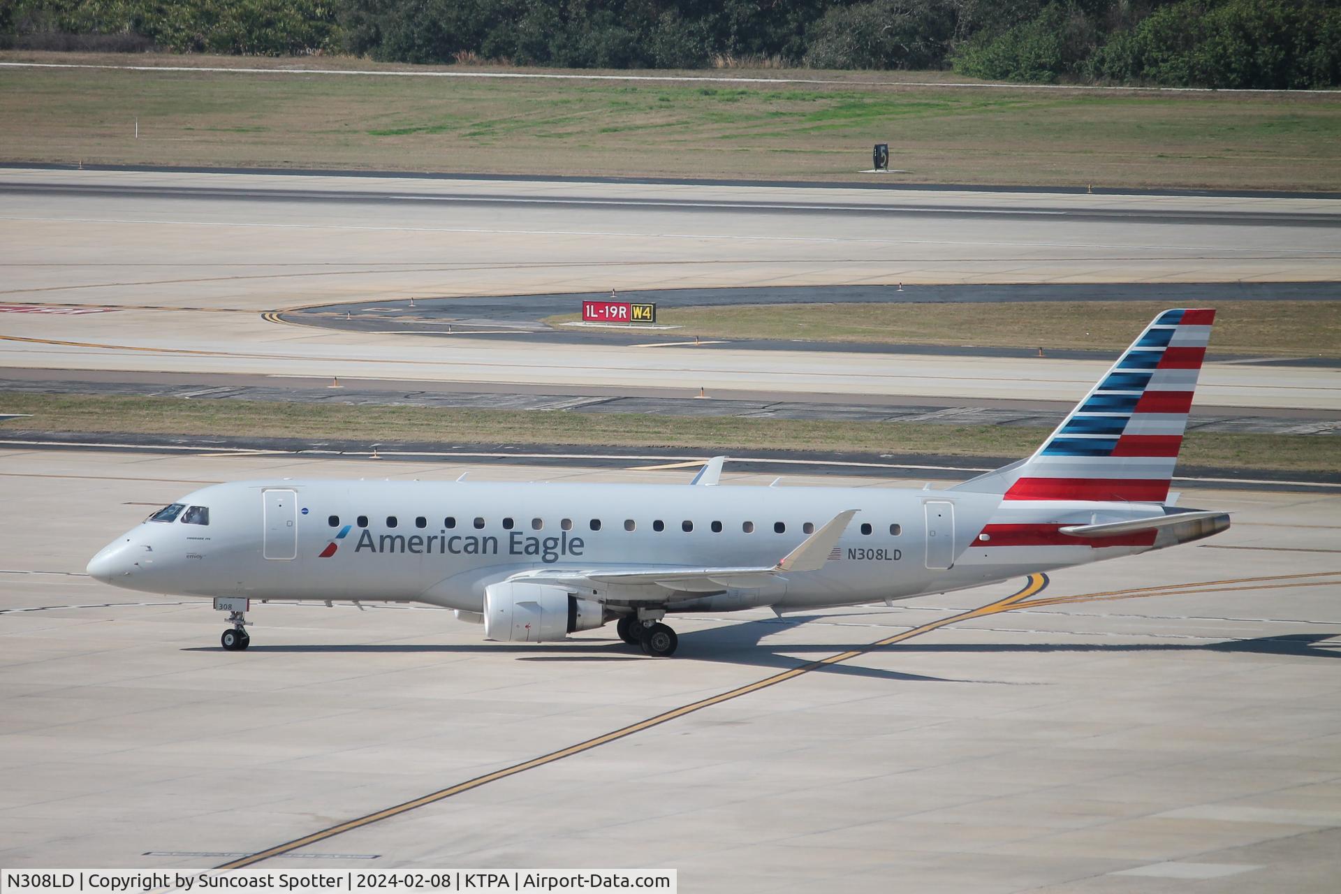 N308LD, 2021 Embraer 175LR (ERJ-170-200LR) C/N 17000874, American Flight 3759 operated by Envoy taxis to gate at Tampa International Airport following flight from Nashville International Airport