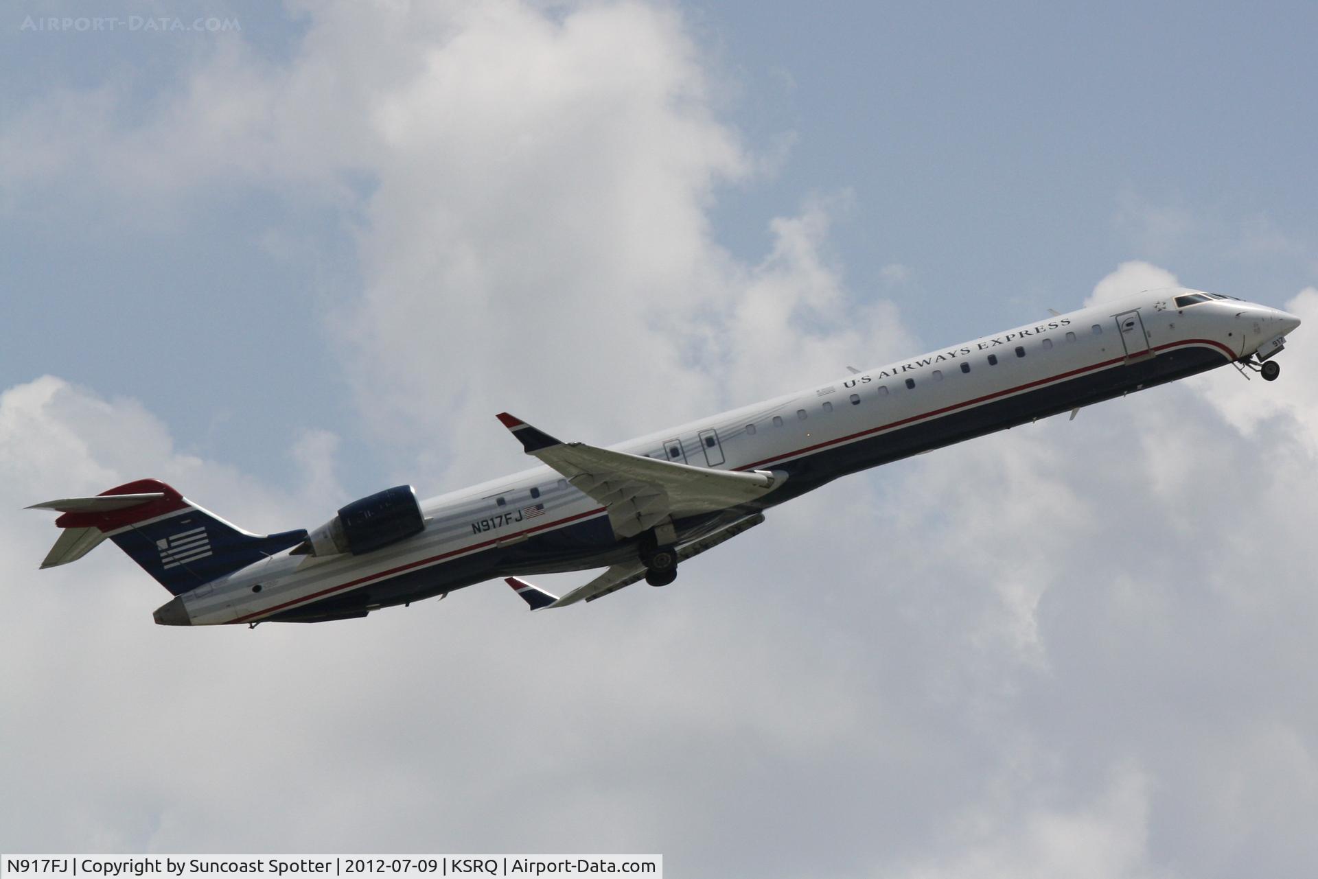N917FJ, 2004 Bombardier CRJ-900ER (CL-600-2D24) C/N 15017, Mesa CRJ departs SRQ
