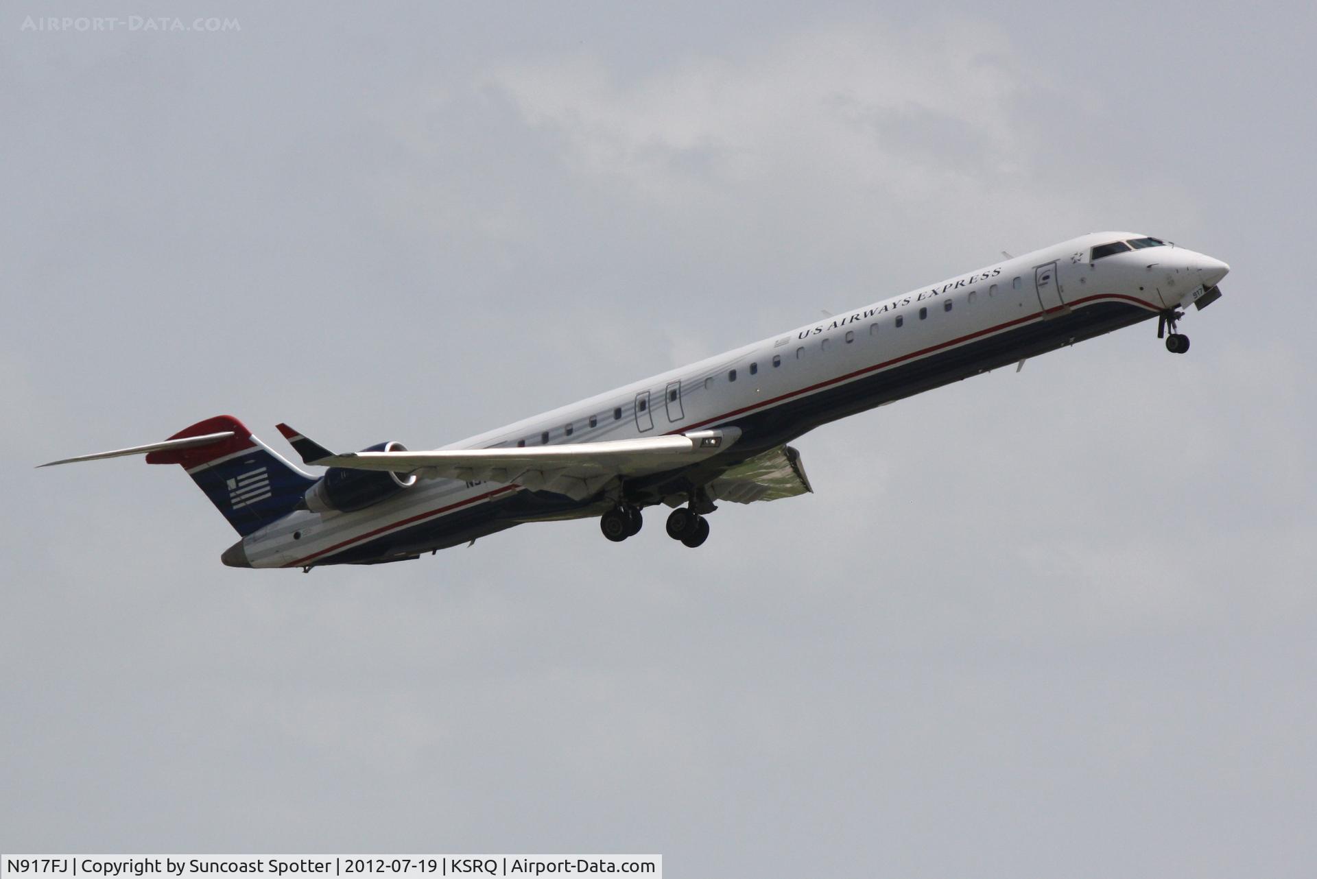 N917FJ, 2004 Bombardier CRJ-900ER (CL-600-2D24) C/N 15017, US Air Flight 2709 operated by Mesa departs Sarasota-Bradenton International Airport enroute to Charlotte-Douglas International Airport