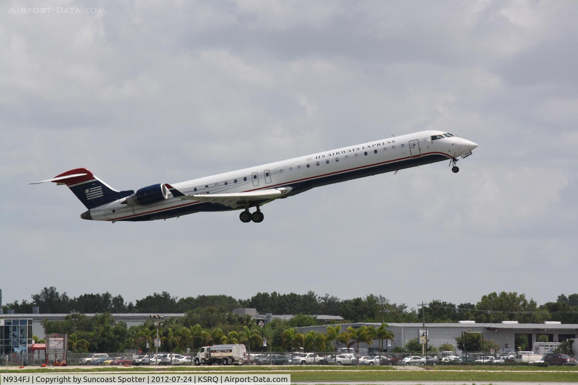 N934FJ, 2005 Bombardier CRJ-900ER (CL-600-2D24) C/N 15034, US Air Flight 2709 operated by Mesa departs Runway 14 at Sarasota-Bradenton International Airport enroute to Charlotte-Douglas International Airport