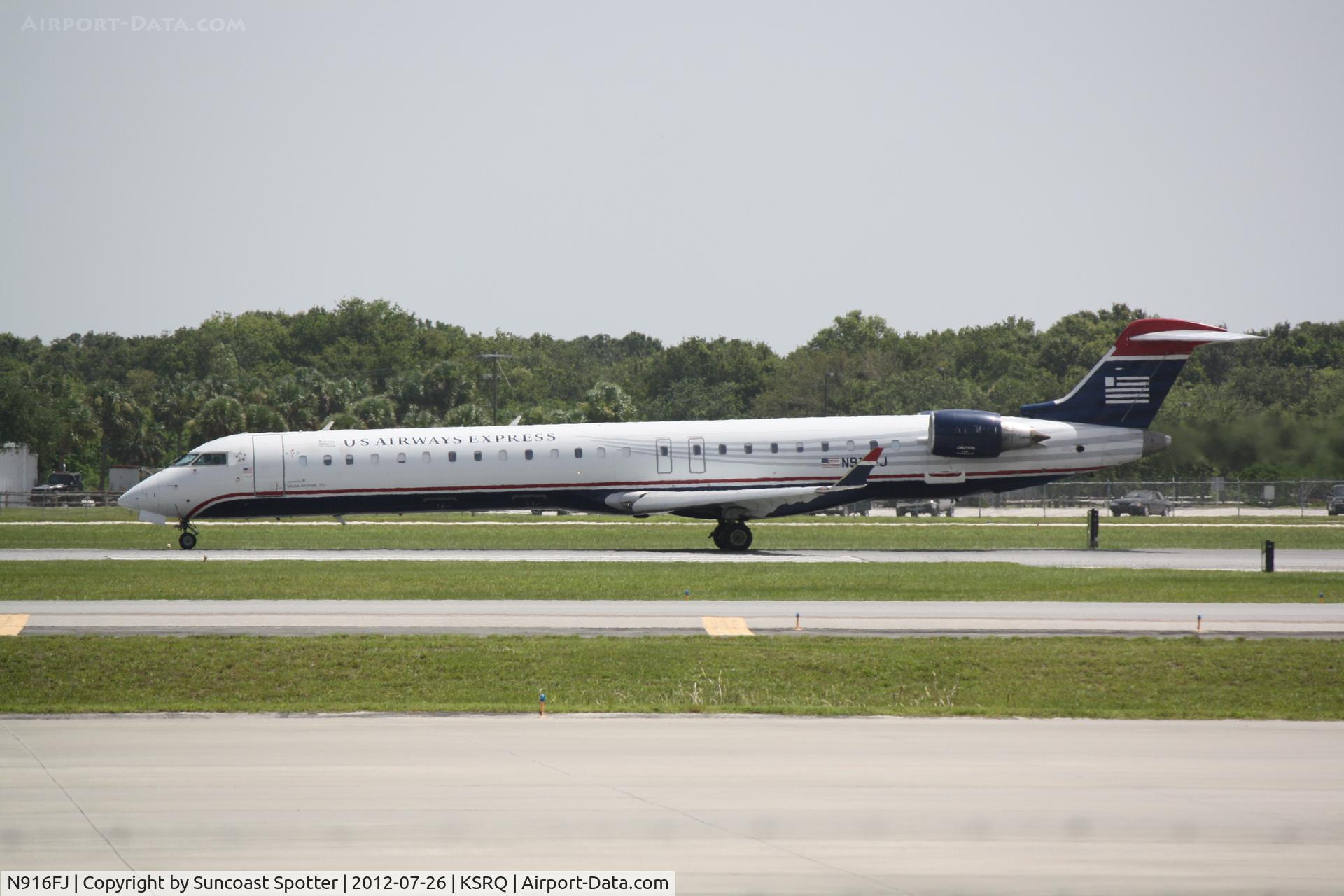 N916FJ, 2004 Bombardier CRJ-900ER (CL-600-2D24) C/N 15016, US Air Flight 2609 operated by Mesa departs Sarasota-Bradenton International Airport enroute to Charlotte-Douglas International Airport