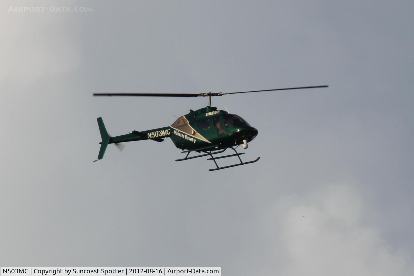 N503MC, Bell OH-58A C/N 72-21346, MSO Air One flies over McKechnie Field in Bradenton, Florida