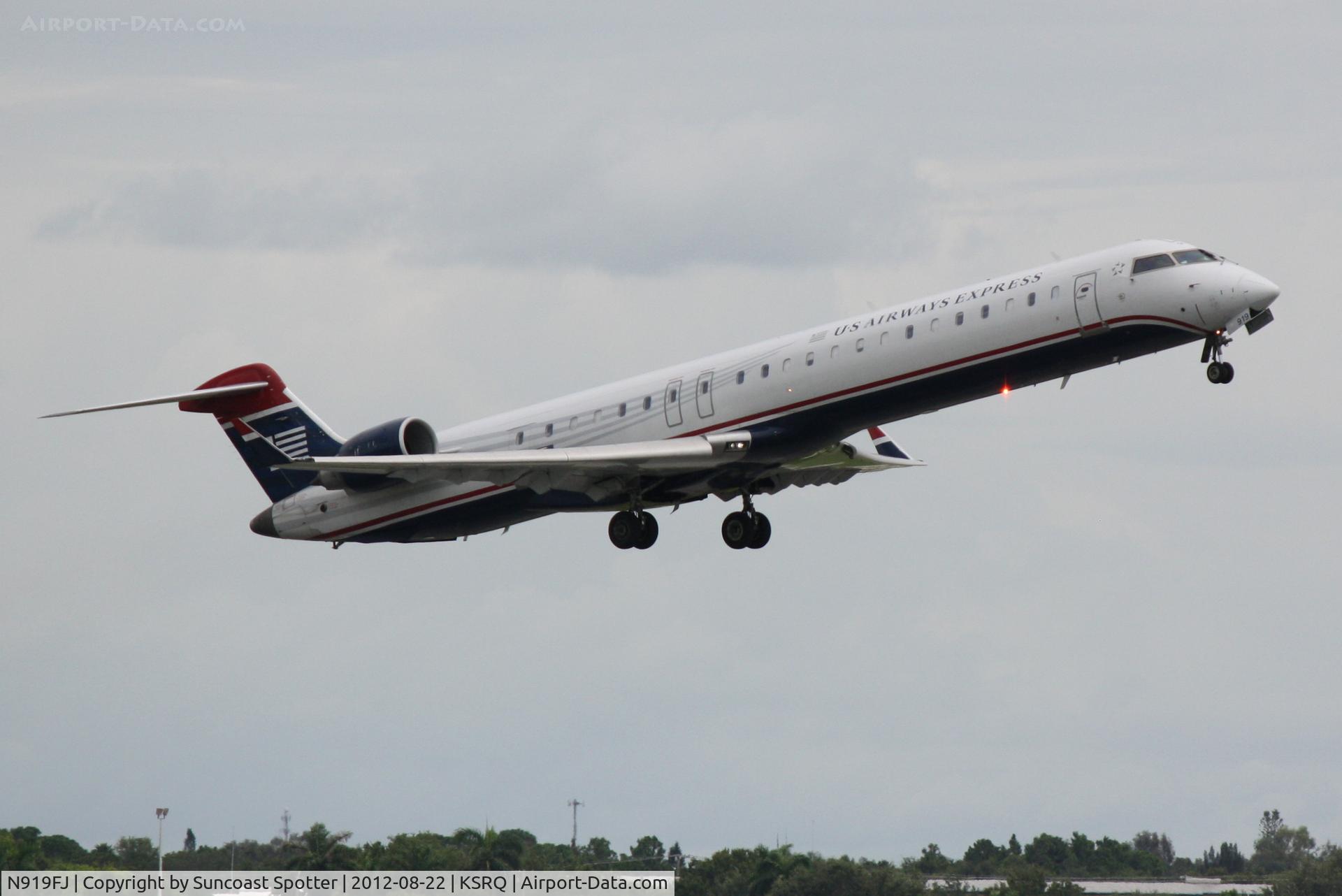 N919FJ, 2004 Bombardier CRJ-900ER (CL-600-2D24) C/N 15019, US Air Flight 2607 operated by Mesa departs Sarasota-Bradenton International Airport enroute to Charlotte Douglas International Airport