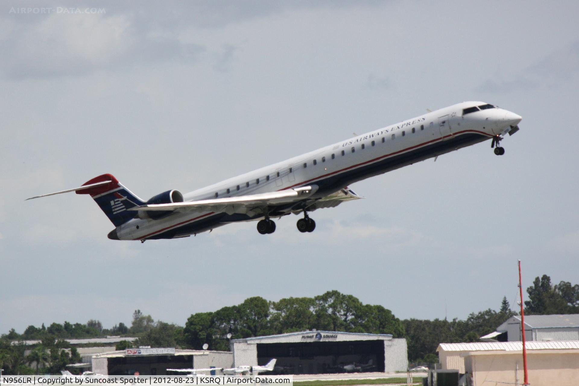 N956LR, 2005 Bombardier CRJ-900ER (CL-600-2D24) C/N 15056, US Air Flight 2607 operated by Mesa departs Sarasota-Bradenton International Airport enroute to Charlotte-Douglas International Airport