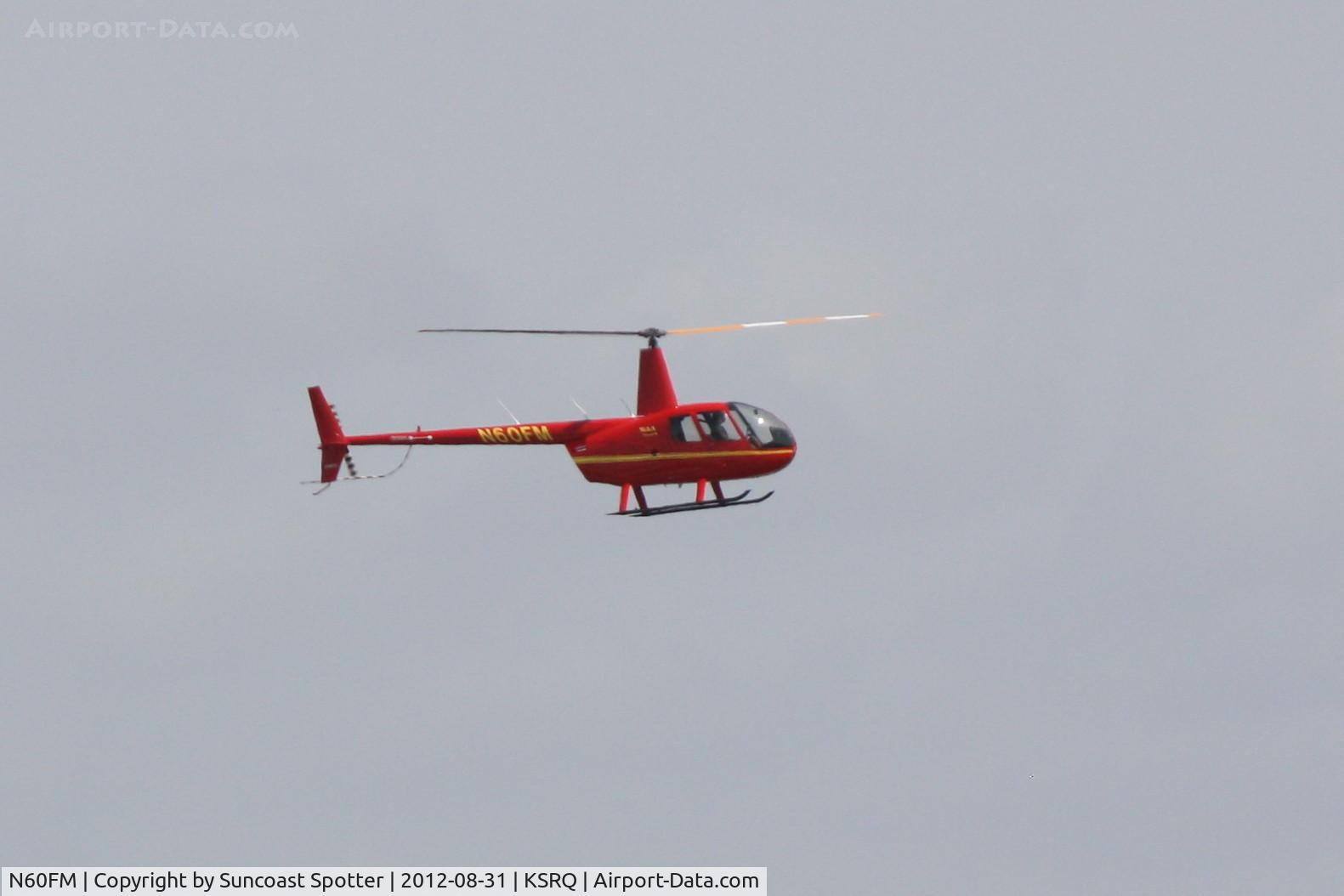 N60FM, Robinson R44 II C/N 12812, Robinson R-44 departs Sarasota-Bradenton International Airport