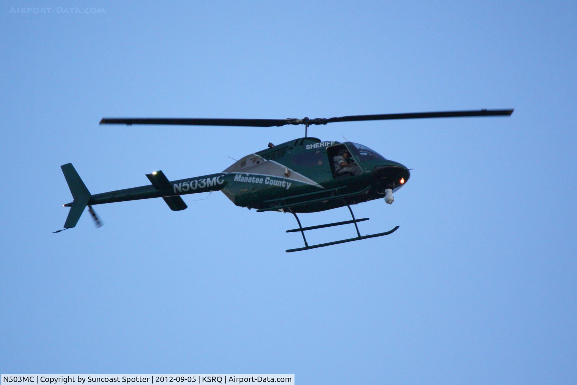N503MC, Bell OH-58A C/N 72-21346, Manatee County Sheriff's Office Aviation Unit flies over Sarasota-Bradenton International Airport