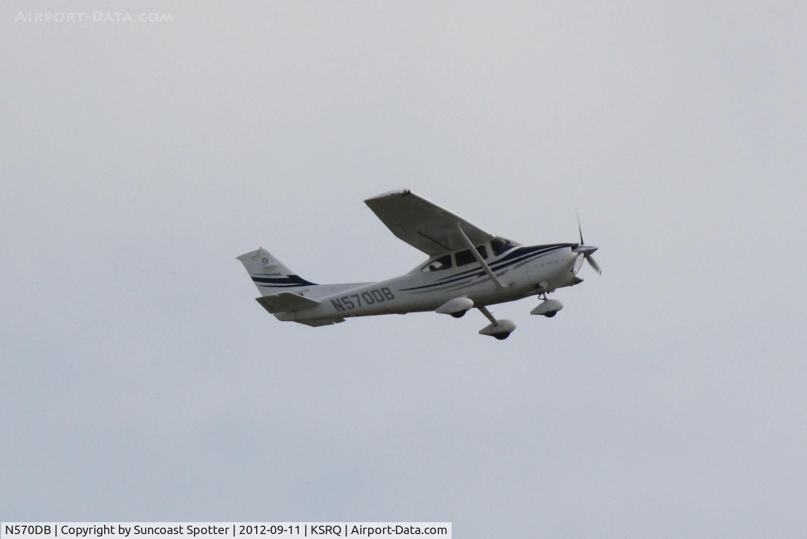N570DB, 2005 Cessna 182T Skylane C/N 18281570, Cessna Skylane performs a touch and go at Sarasota-Bradenton International Airport