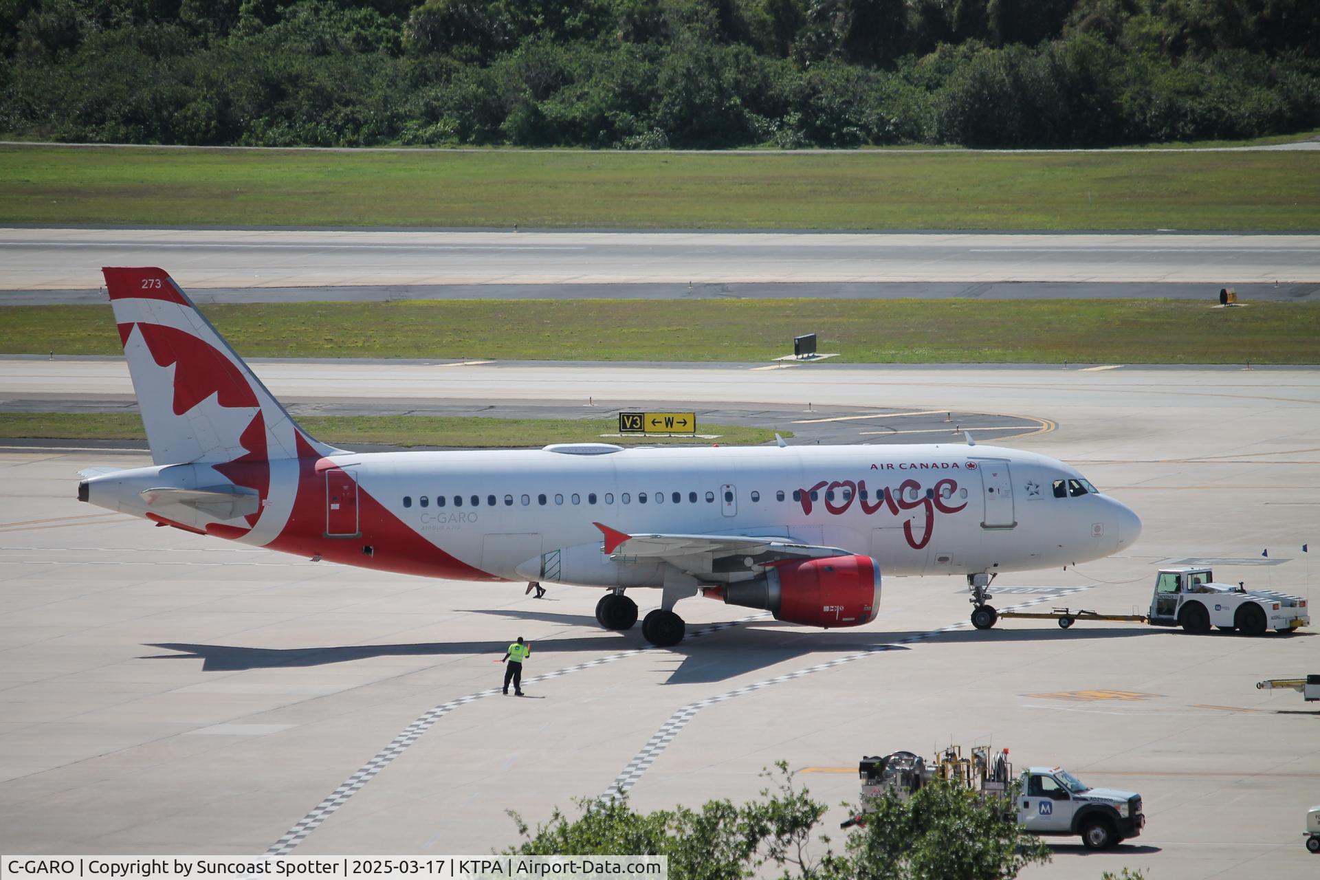 C-GARO, 1997 Airbus A319-114 C/N 757, Rouge Flight 1659 pushes back at Tampa International Airport prior to flight to Toronto-Pearson International Airport