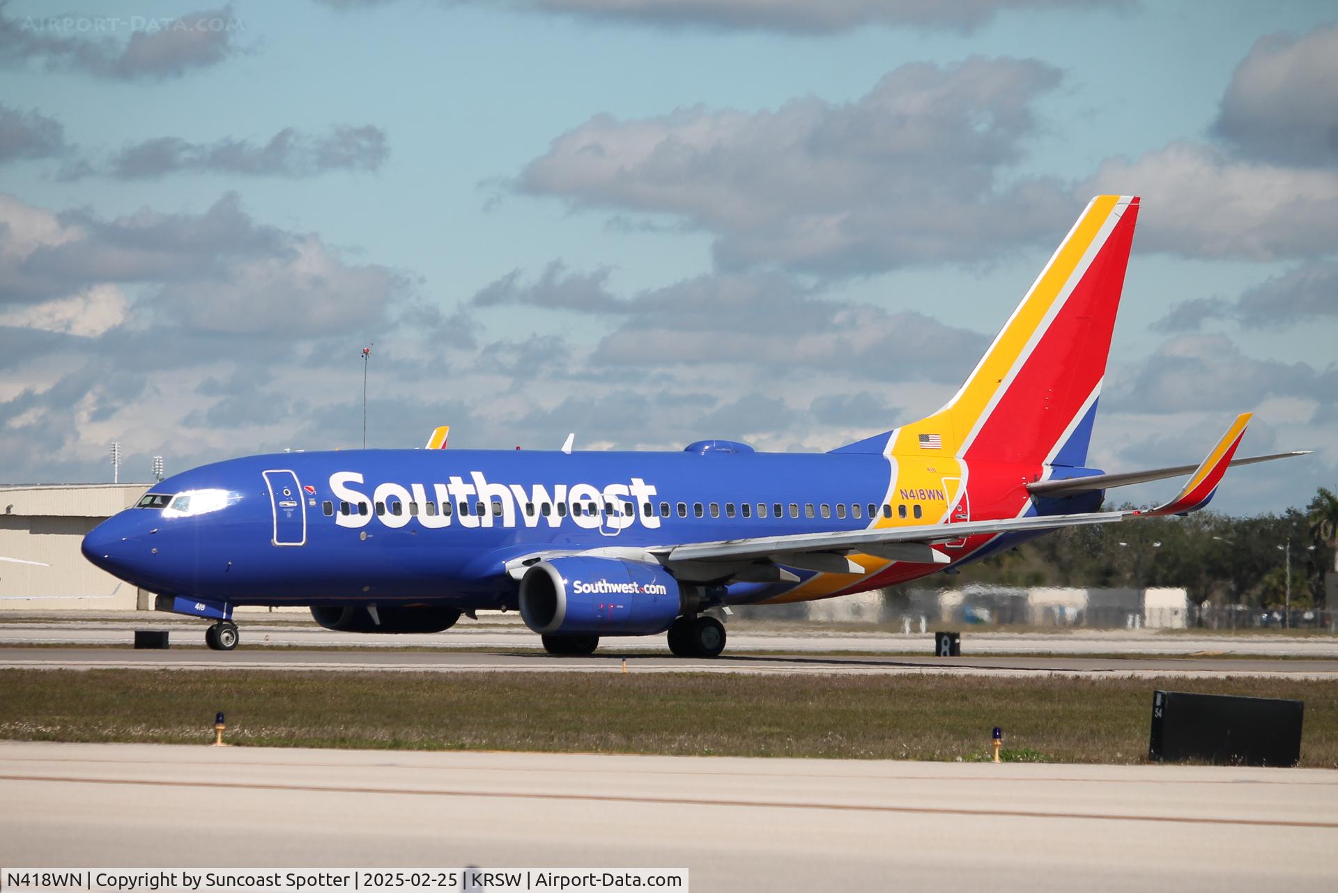 N418WN, 2001 Boeing 737-7H4 C/N 29823, Southwest Flight 2328 taxis at Southwest Florida International Airport prior to flight to Columbus-John Glenn International Airport
