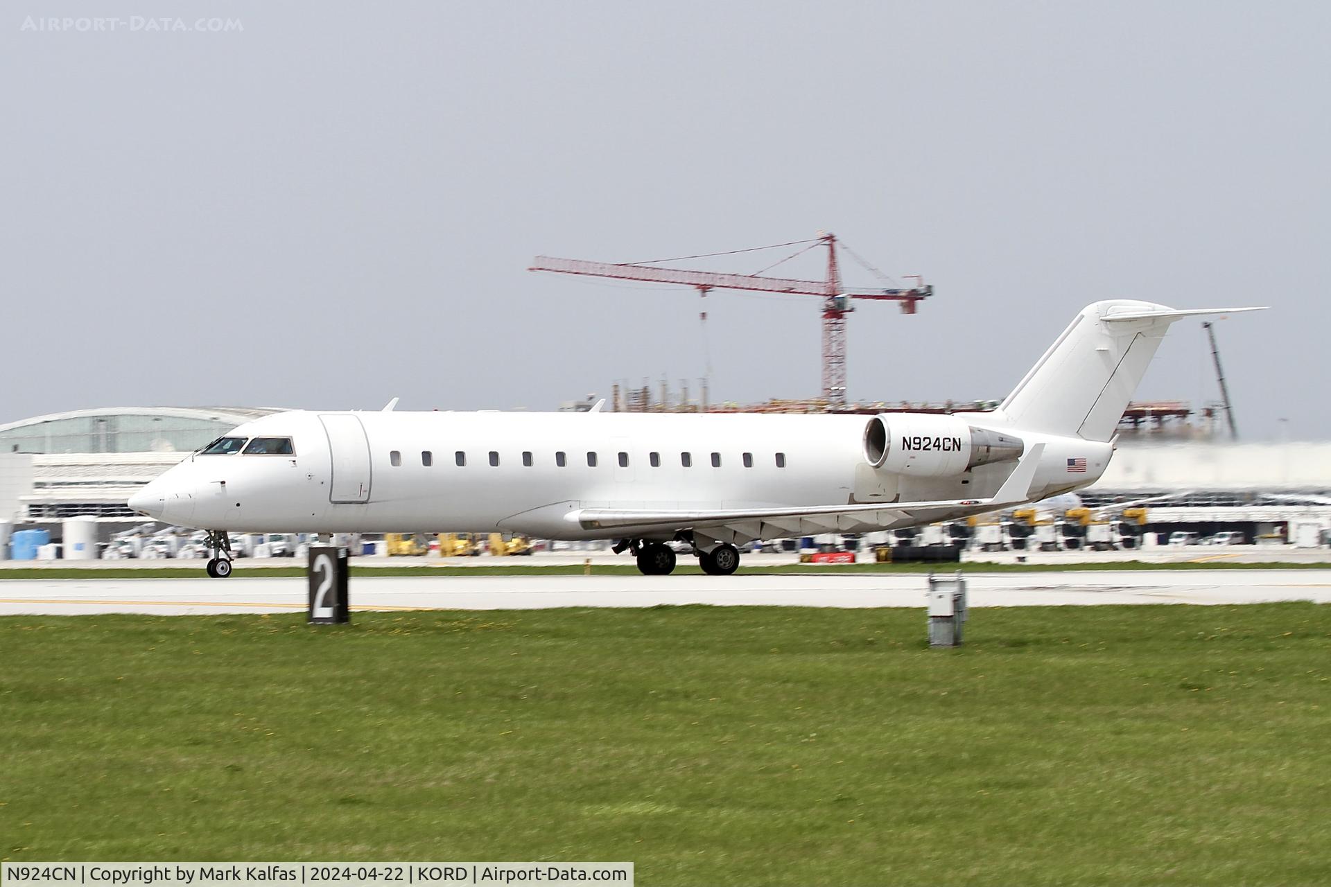 N924CN, 2001 Canadair CRJ-200LR (CL-600-2B19) C/N 7494, CRJ2 Contour Airlines/ Corporate Flight Management Bombardier CL-600-2B19 N924CN departing 22L KORD