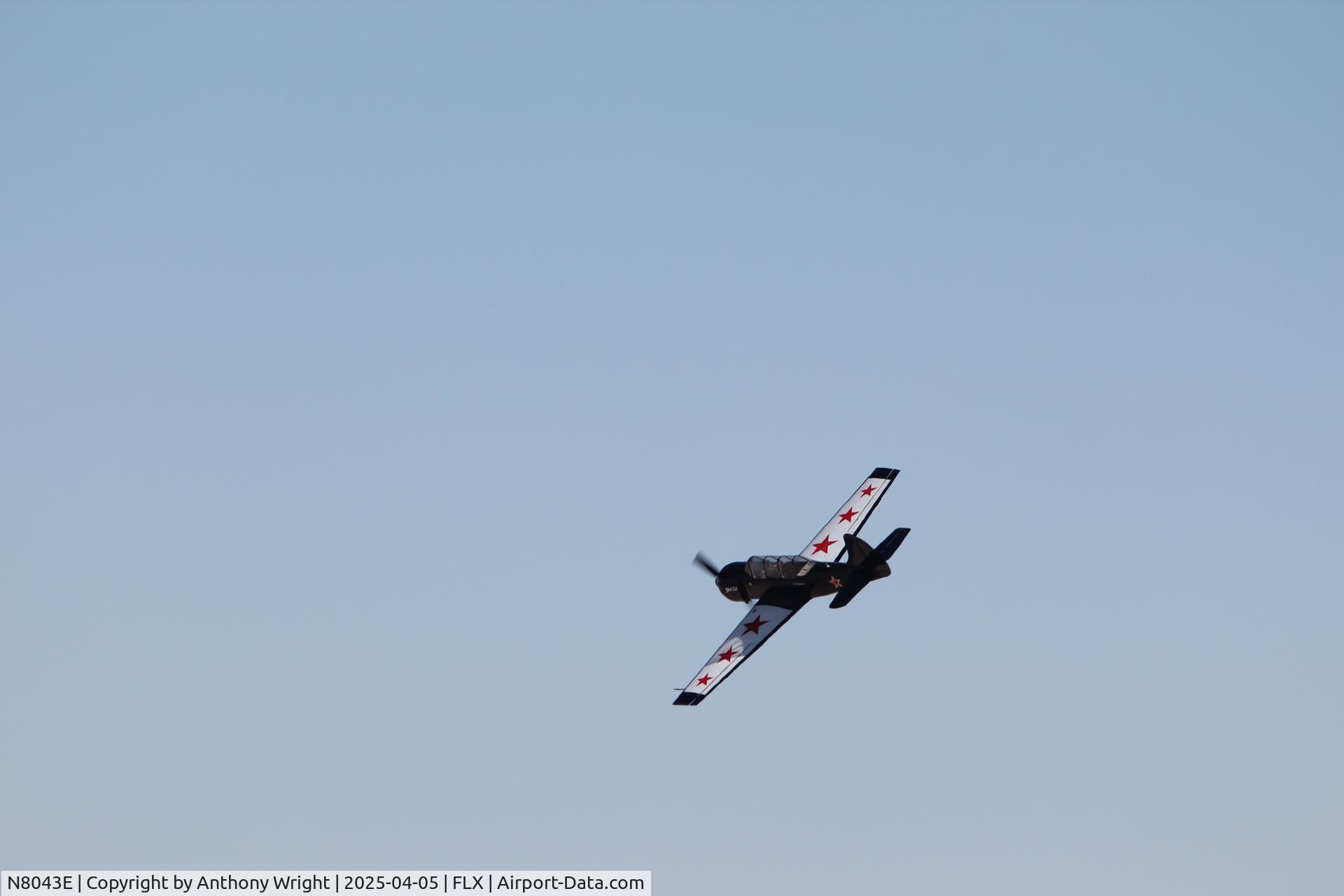 N8043E, 1987 Yakovlev Yak-52 C/N 877503, Caught in the air above Rattlesnake Raceway, Fallon, NV