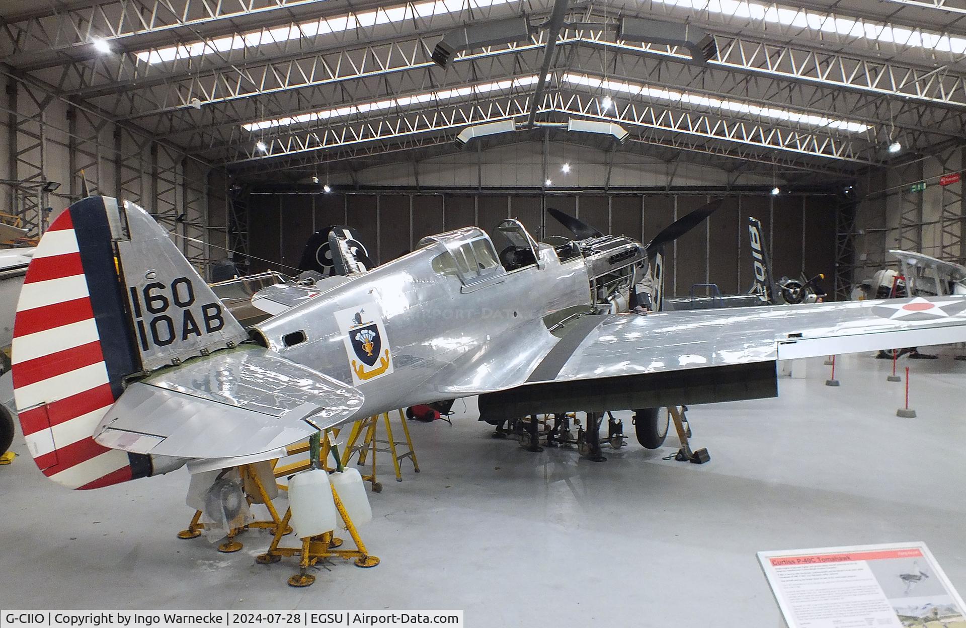 G-CIIO, 1941 Curtiss P-40C Warhawk C/N 16161, Curtiss P-40C Warhawk undergoing maintenance at the IWM and other collections, Duxford