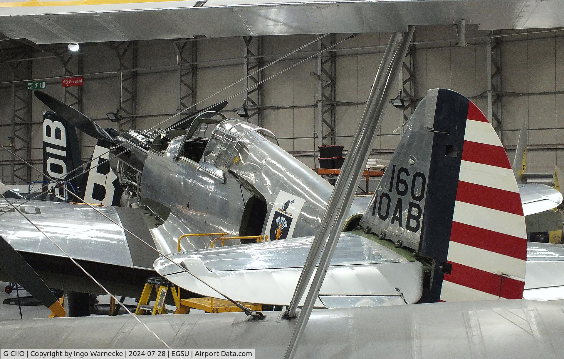 G-CIIO, 1941 Curtiss P-40C Warhawk C/N 16161, Curtiss P-40C Warhawk undergoing maintenance at the IWM and other collections, Duxford