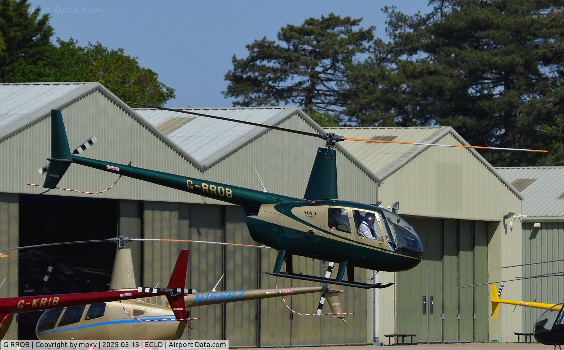 G-RROB, 2002 Robinson R44 II C/N 10011, Robinson R44 Raven II at Denham.