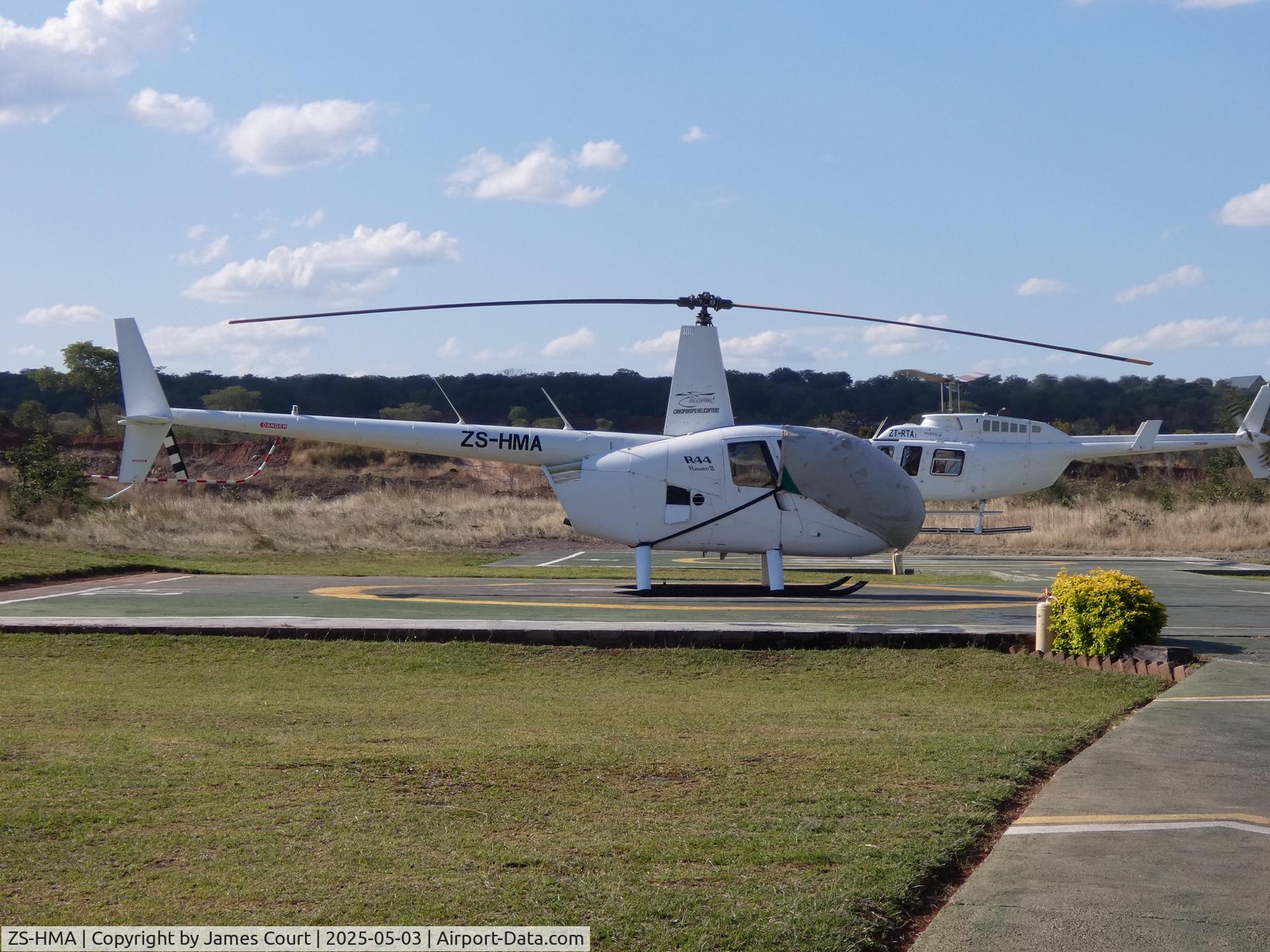 ZS-HMA, Bell 412SP C/N 33128, ZS-HMA at Chikopokopo Heliport (ZW-0056), Zimbabwe