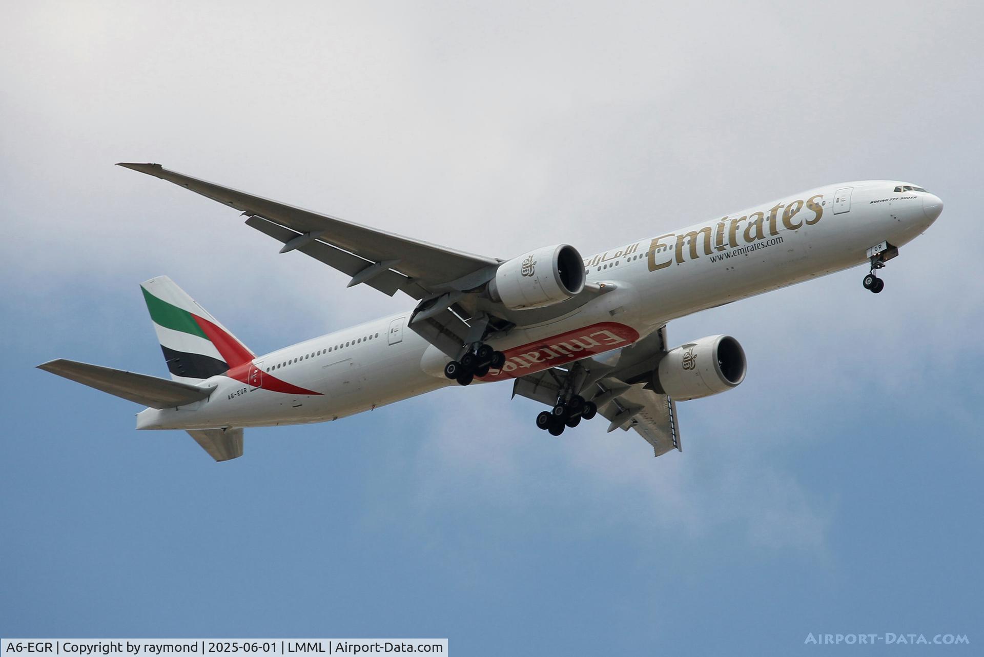 A6-EGR, 2012 Boeing 777-31H/ER C/N 41077, Boeing 777-31H/ER of Emirates Airlines reg A6-EGR on long finals for RW13 in Malta.