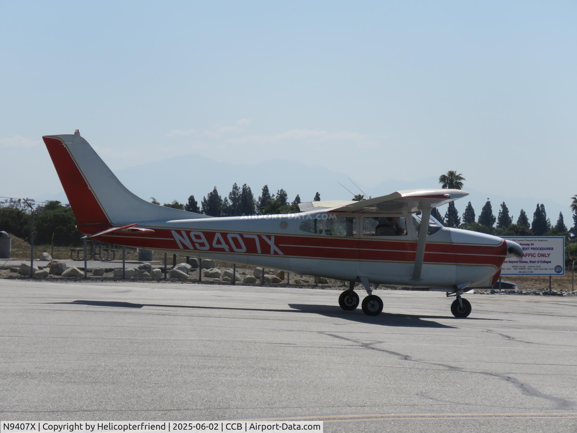 N9407X, 1961 Cessna 210A C/N 21057707, Stopped by hangers