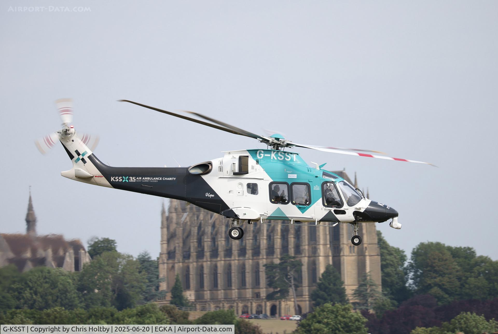 G-KSST, 2016 AgustaWestland AW169 C/N 69014, Taking off from Shoreham Airport W. Sussex with Lancing College Church in backdrop.
