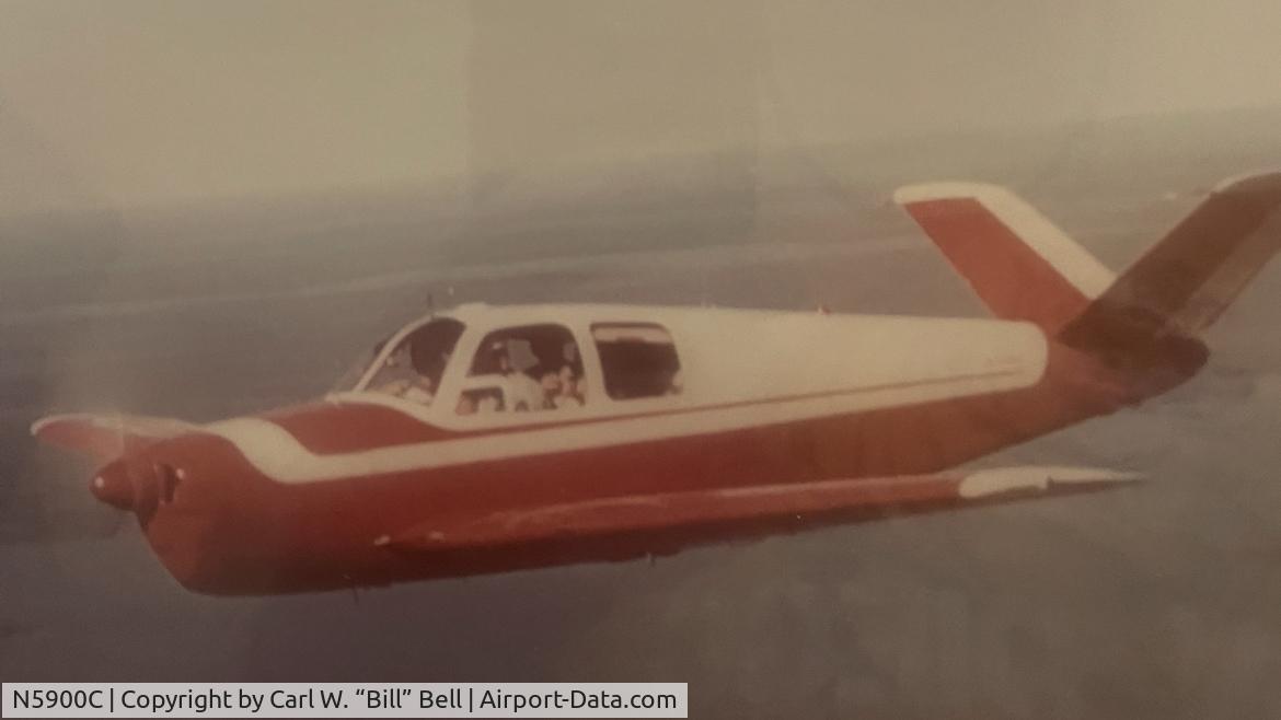 N5900C, 1951 Beech C35 Bonanza C/N D-2854, N5900C flying over Fort Peck Lake. Fort Peck, Montana in late 1950s