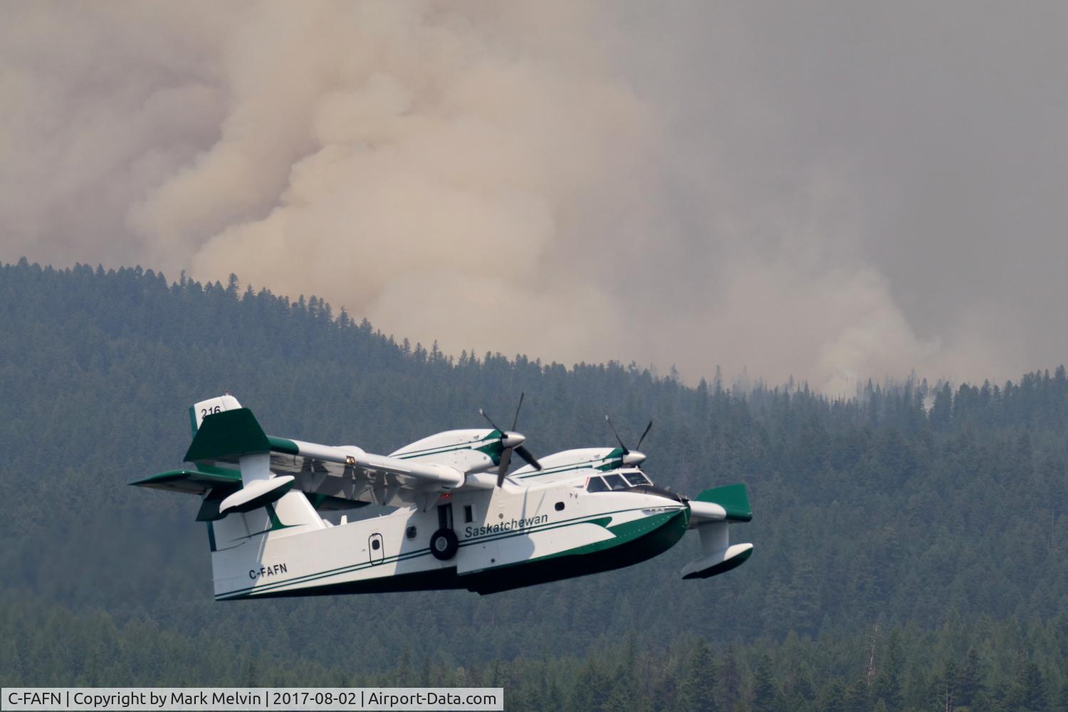 C-FAFN, 1986 Canadair CL-215T (CL-215-6B11) C/N 1093, A Scooper aircraft fighting the Rice Ridge Fire in early August 2017, one of four on location that day. Heavy wildfire smoke rising from behind the ridge in the background.