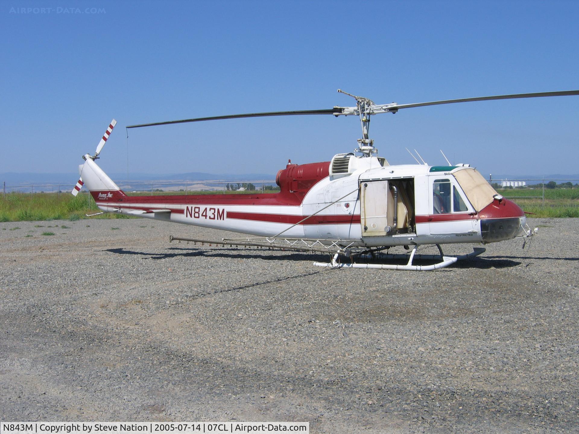 N843M, 1963 Bell UH-1B C/N 63-8676, Av Ag Inc. 1963 Bell UH-1B (63-8676) rigged as sprayer at their Richvale, CA base