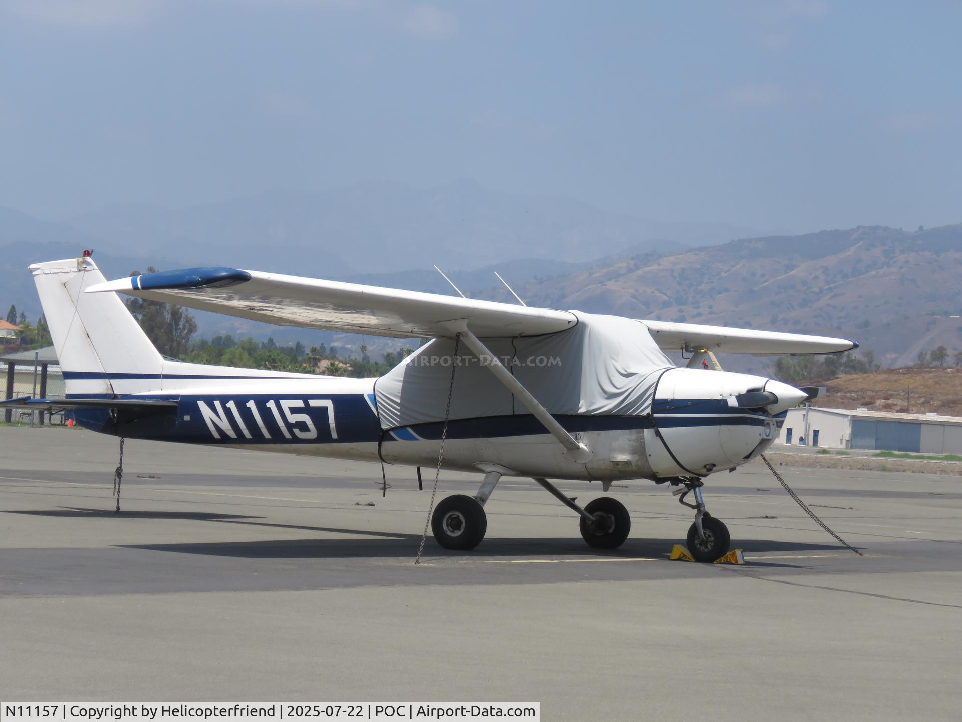 N11157, 1973 Cessna 150L C/N 15075231, Parked in transit, covered & tied down