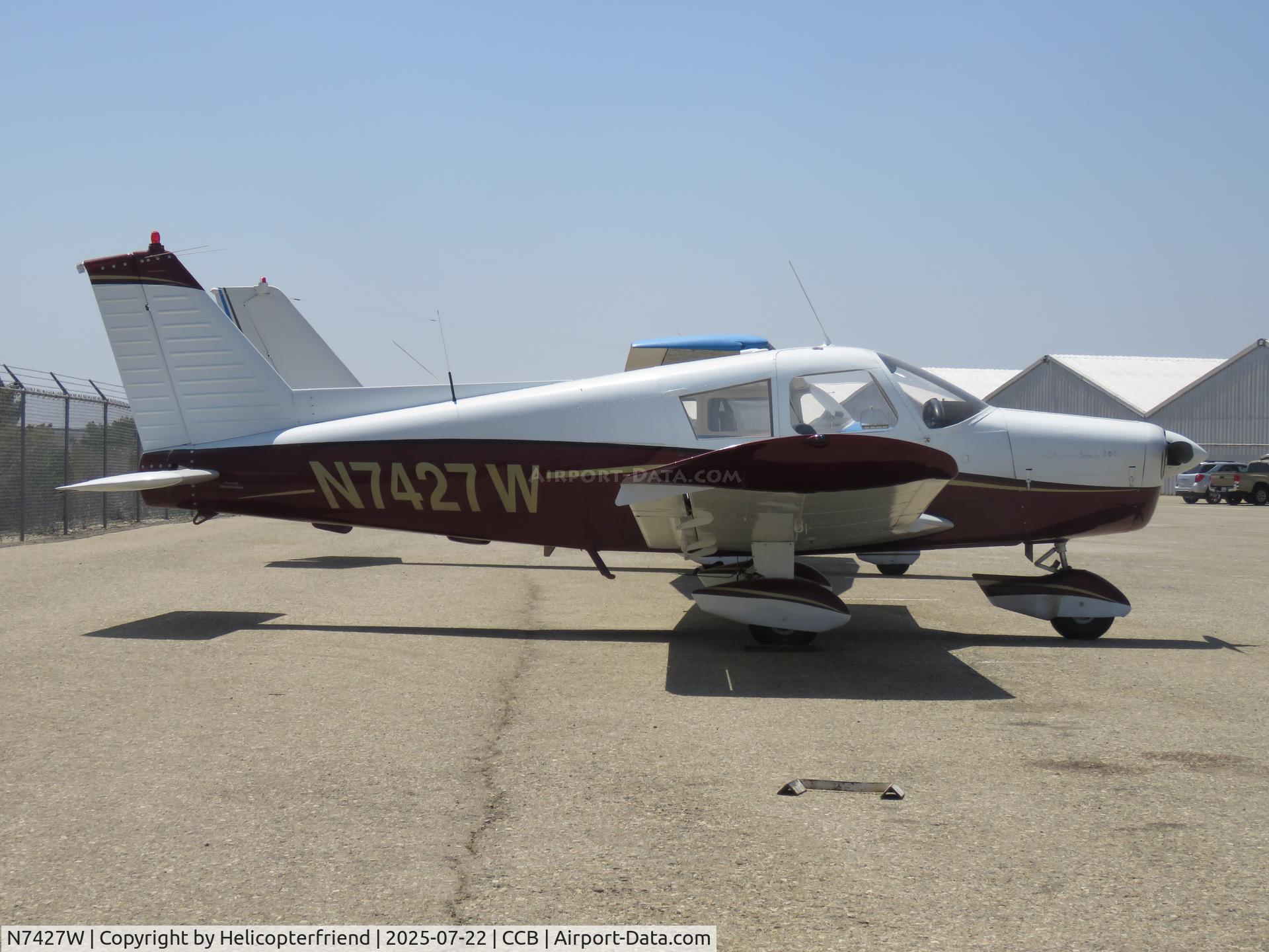 N7427W, 1963 Piper PA-28-180 C/N 28-1315, Parked near south fence