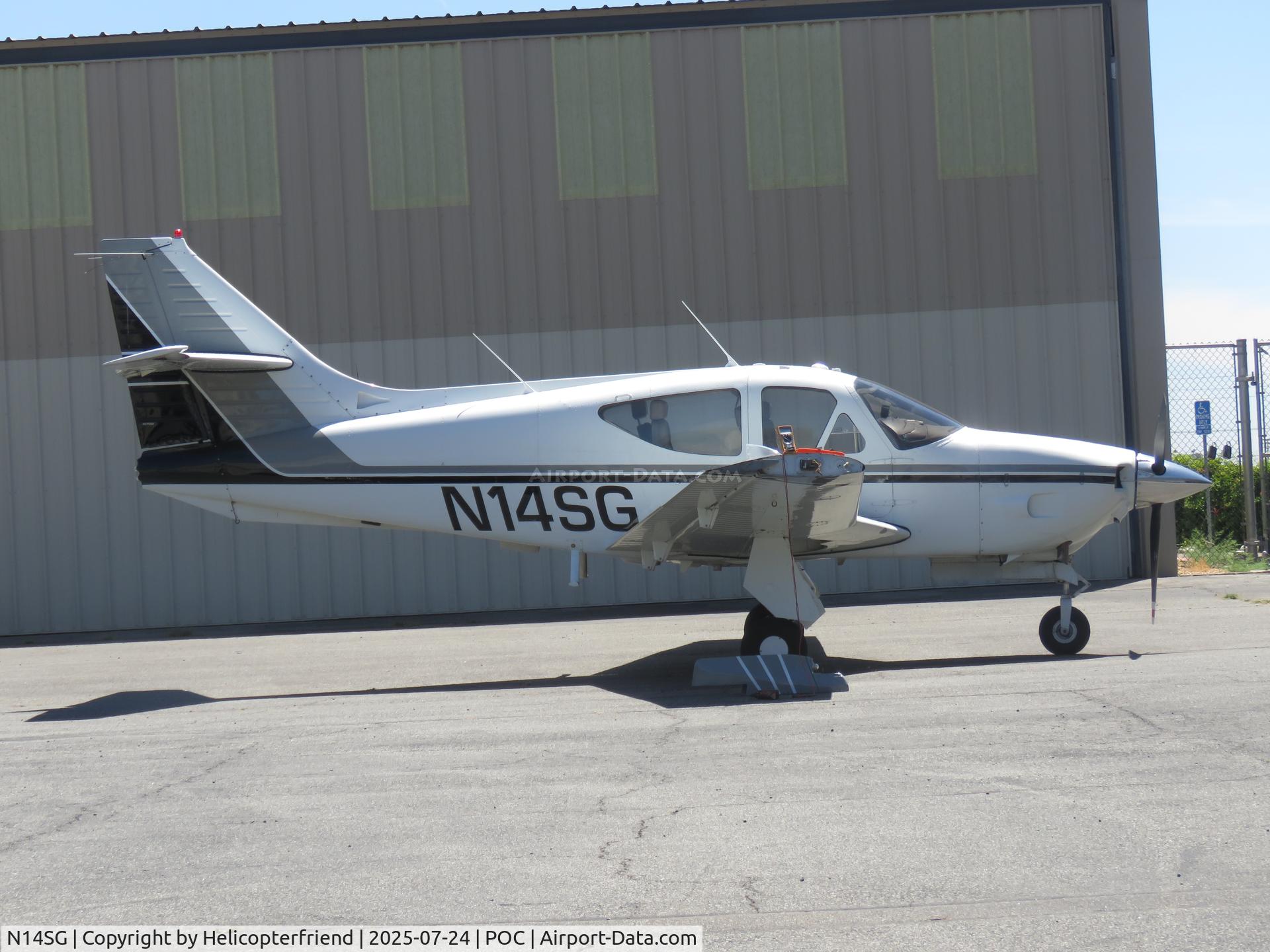 N14SG, 1978 Rockwell International 114 Commander C/N 14434, Parked by a hanger