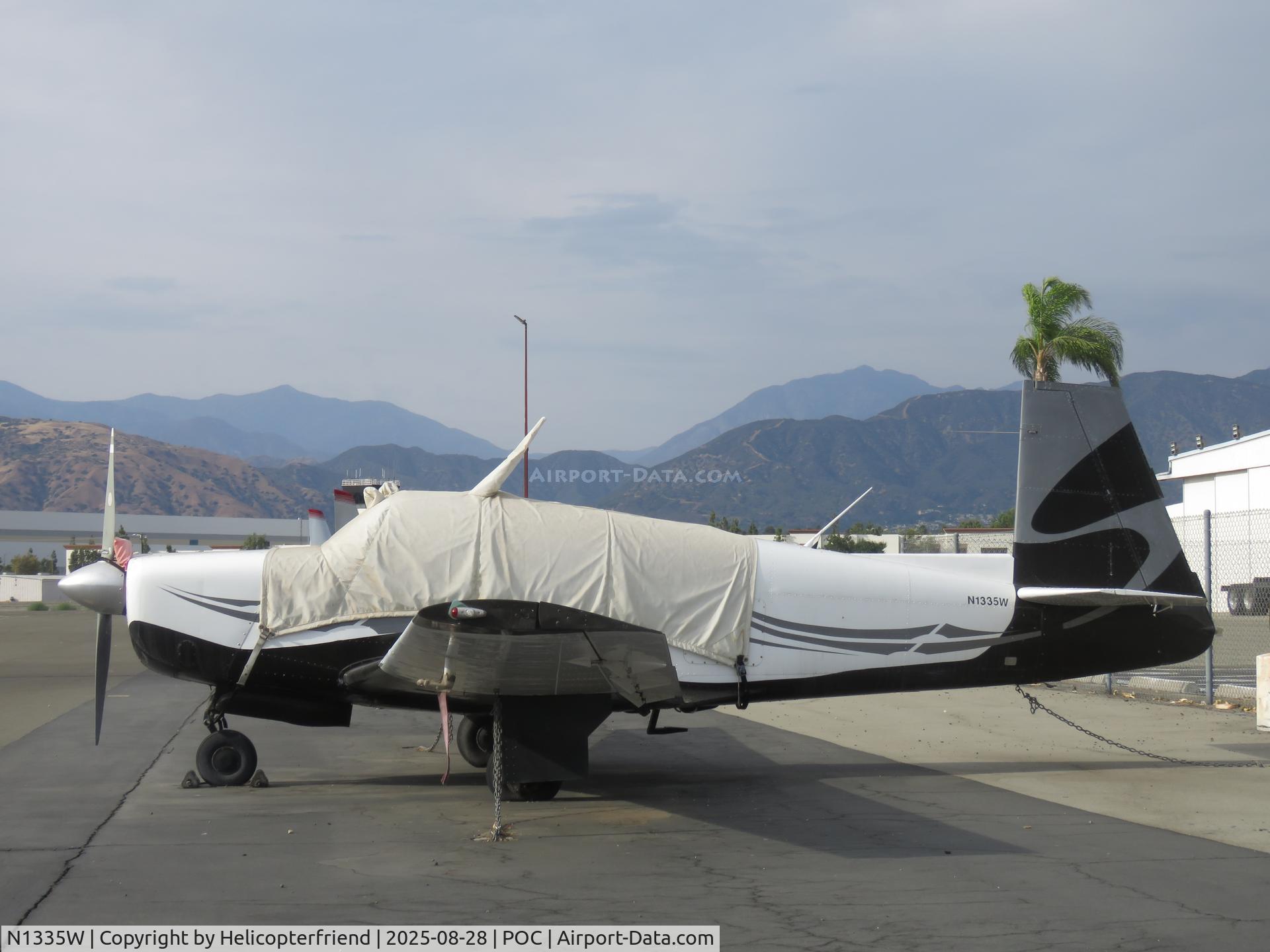 N1335W, 1963 Mooney M20E C/N 223, Parked & covered