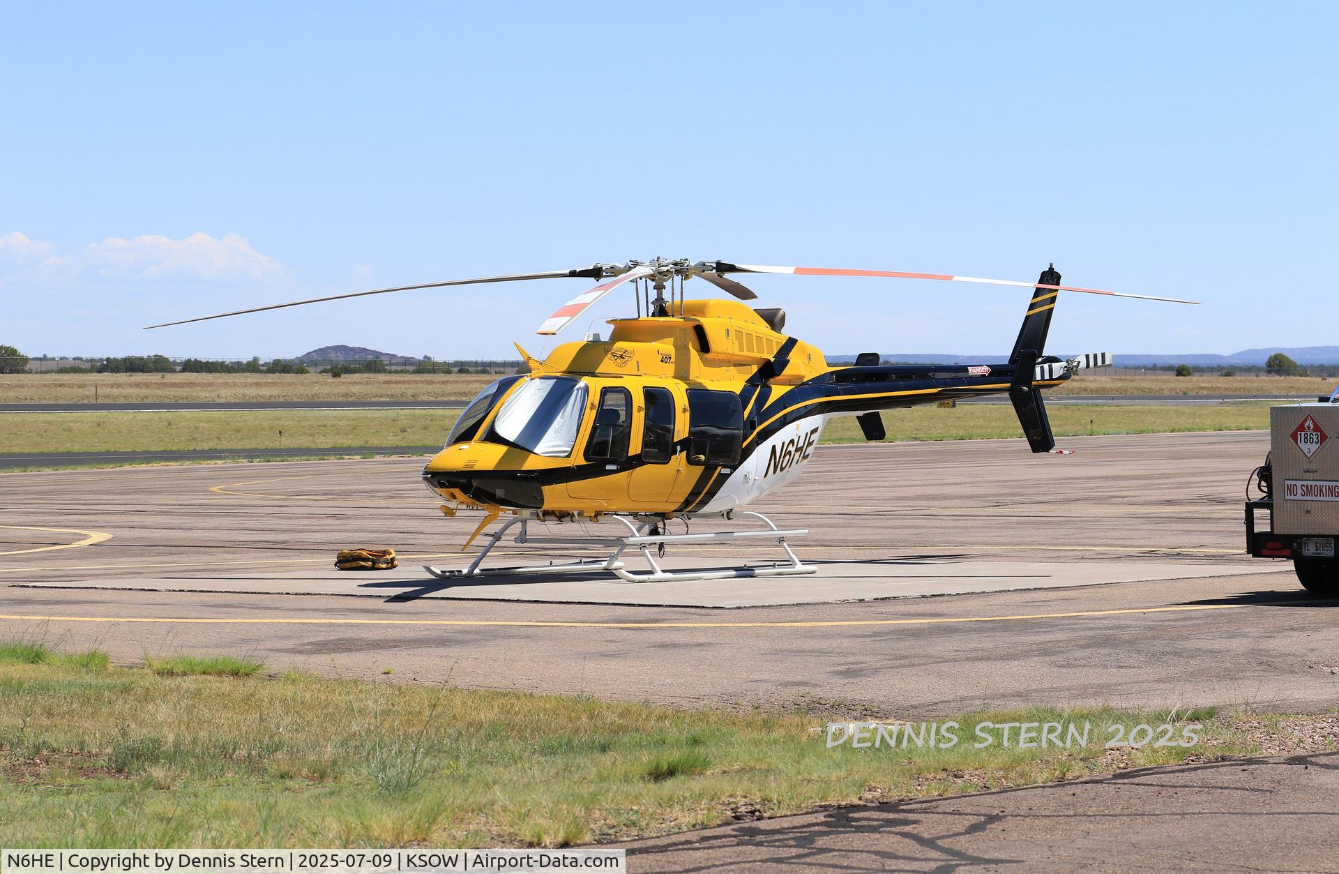 N6HE, 1997 Bell 407 C/N 53235, Helicopter Express's Bell 407 N6HE rests on the tarmac at Show Low, AZ while being prepositioned here for fire season along with one of their Skycranes.