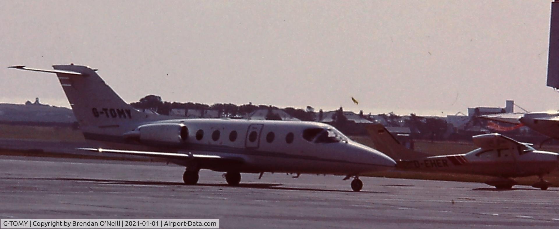 G-TOMY, 1985 Mitsubishi MU-300 Diamond 1A C/N A090SA, Scanned from a slide ,Cant remember location early 90s