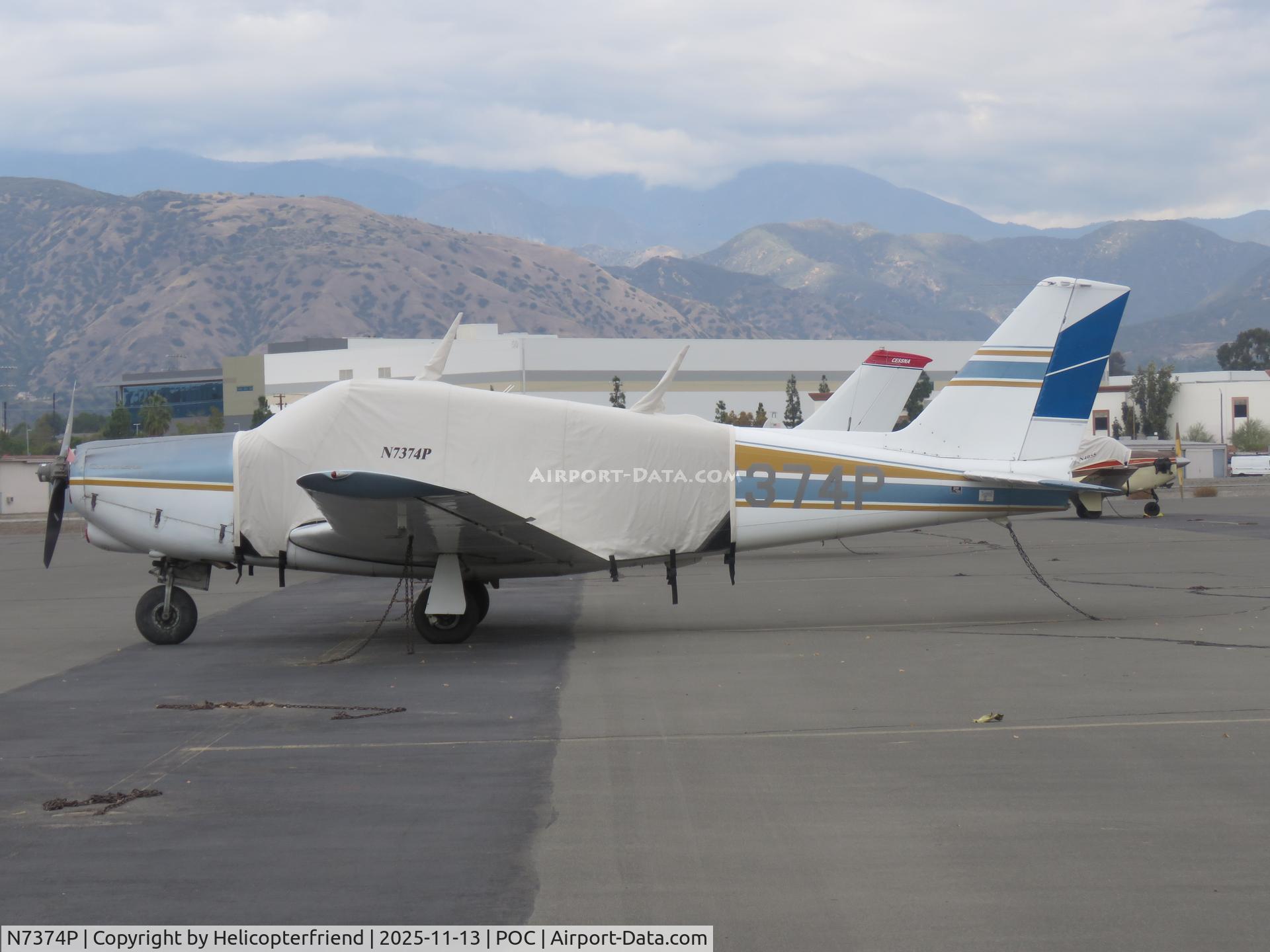 N7374P, 1961 Piper PA-24 C/N 24-2555, Tied down and parked in transit parking