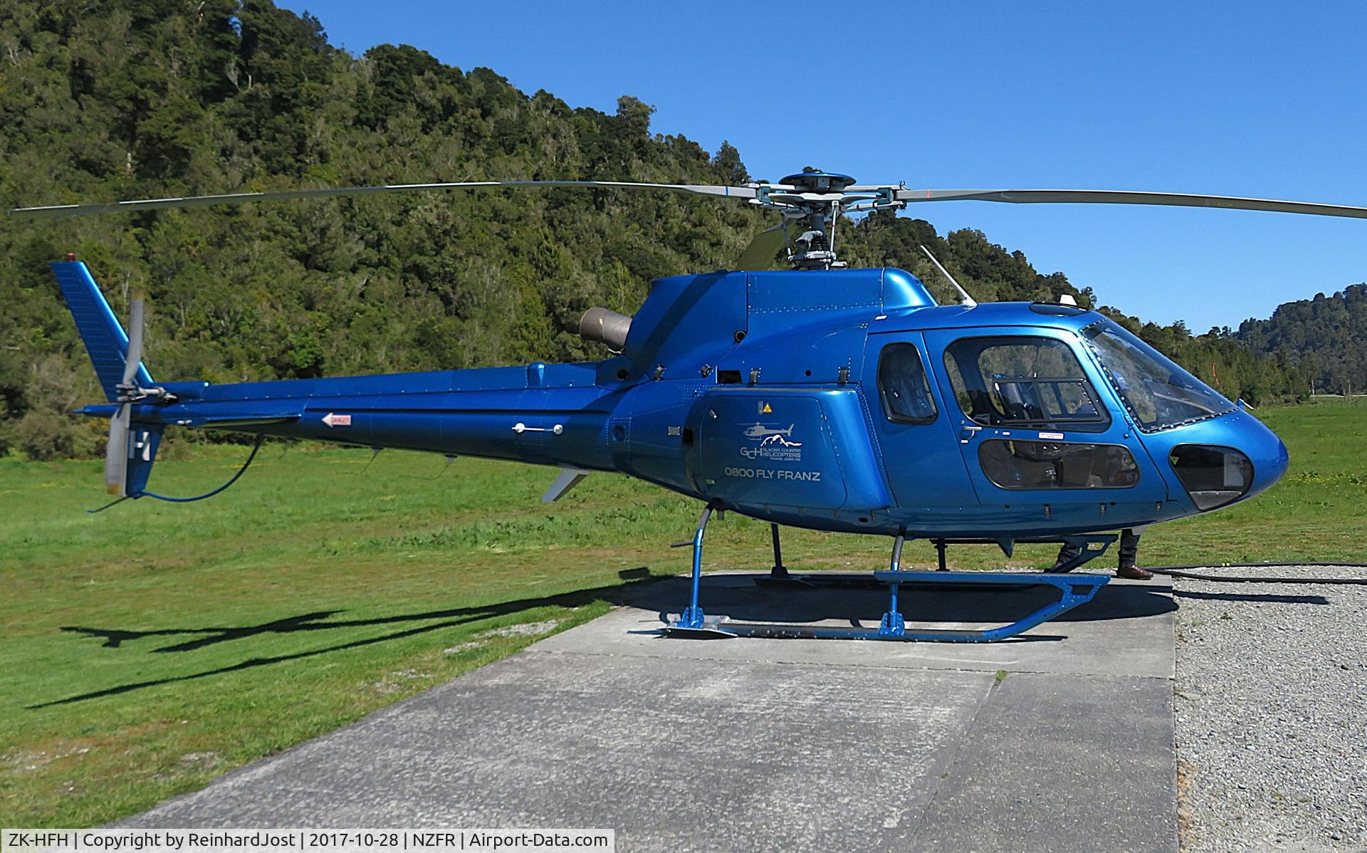 ZK-HFH, Aerospatiale AS-350B-2 Ecureuil C/N 2132, Awaiting tourists for a scenic flight over the glaciers at Franz Josef Heliport, South Island, New Zealand