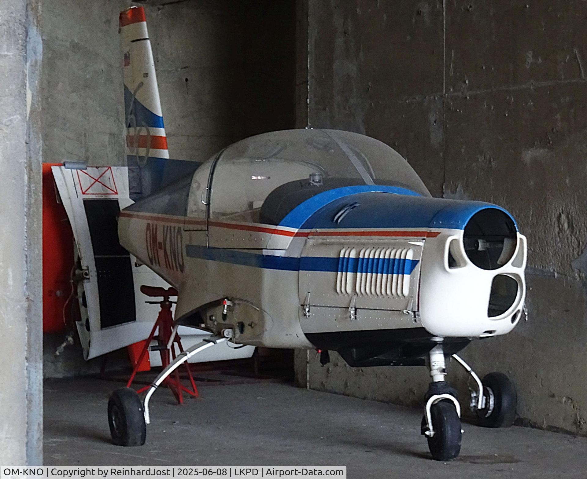 OM-KNO, 1980 Zlin Z-142 C/N 201, Early Zlin Z-142 (ex-OK-KNO / OK-090) n parts at a concret hangar at Pardubice AFB, Czech Republic
