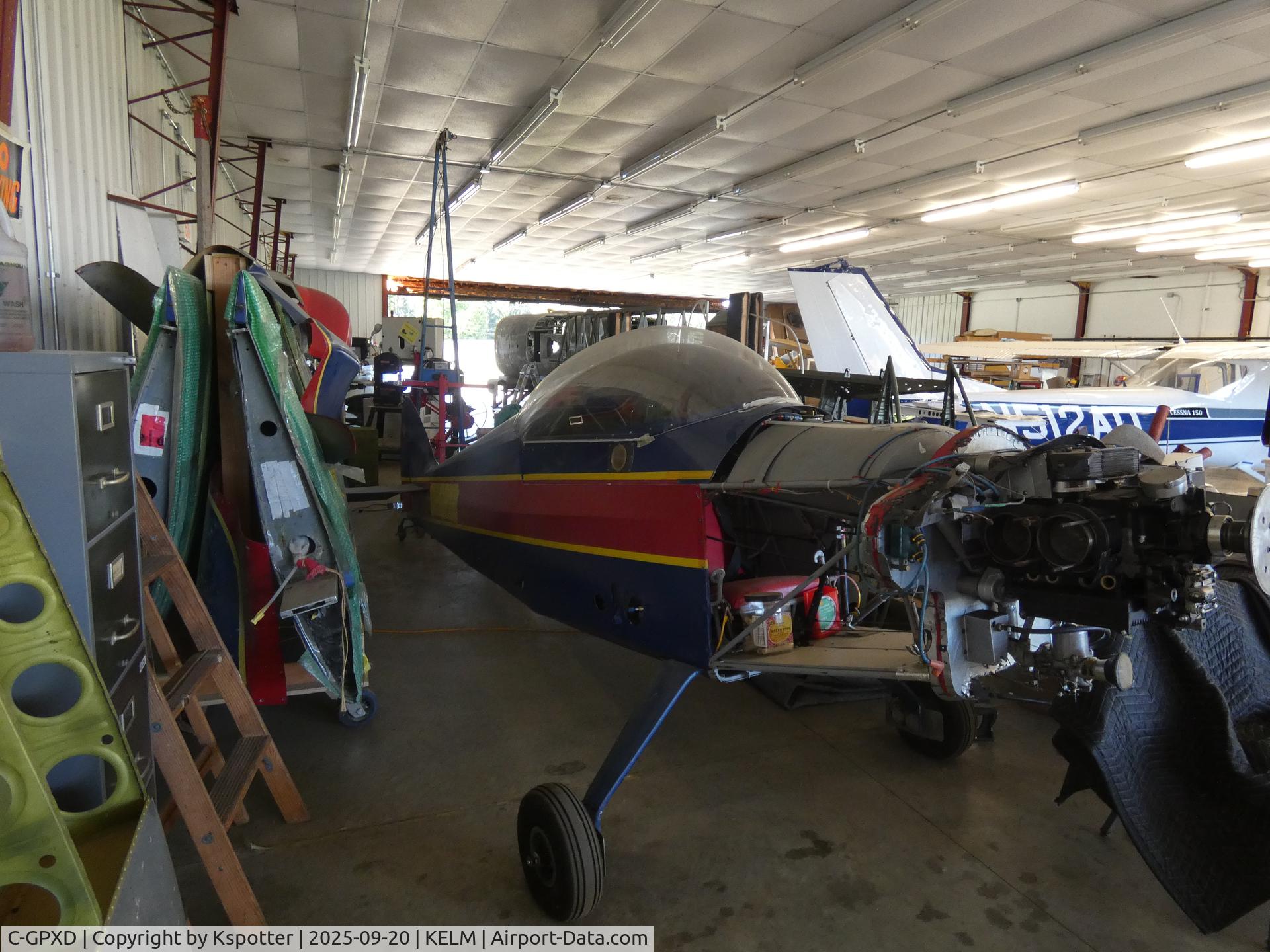 C-GPXD, 1987 Monnett Sonerai II-L C/N 674, Sad to see it stored away behind a bunch of parts