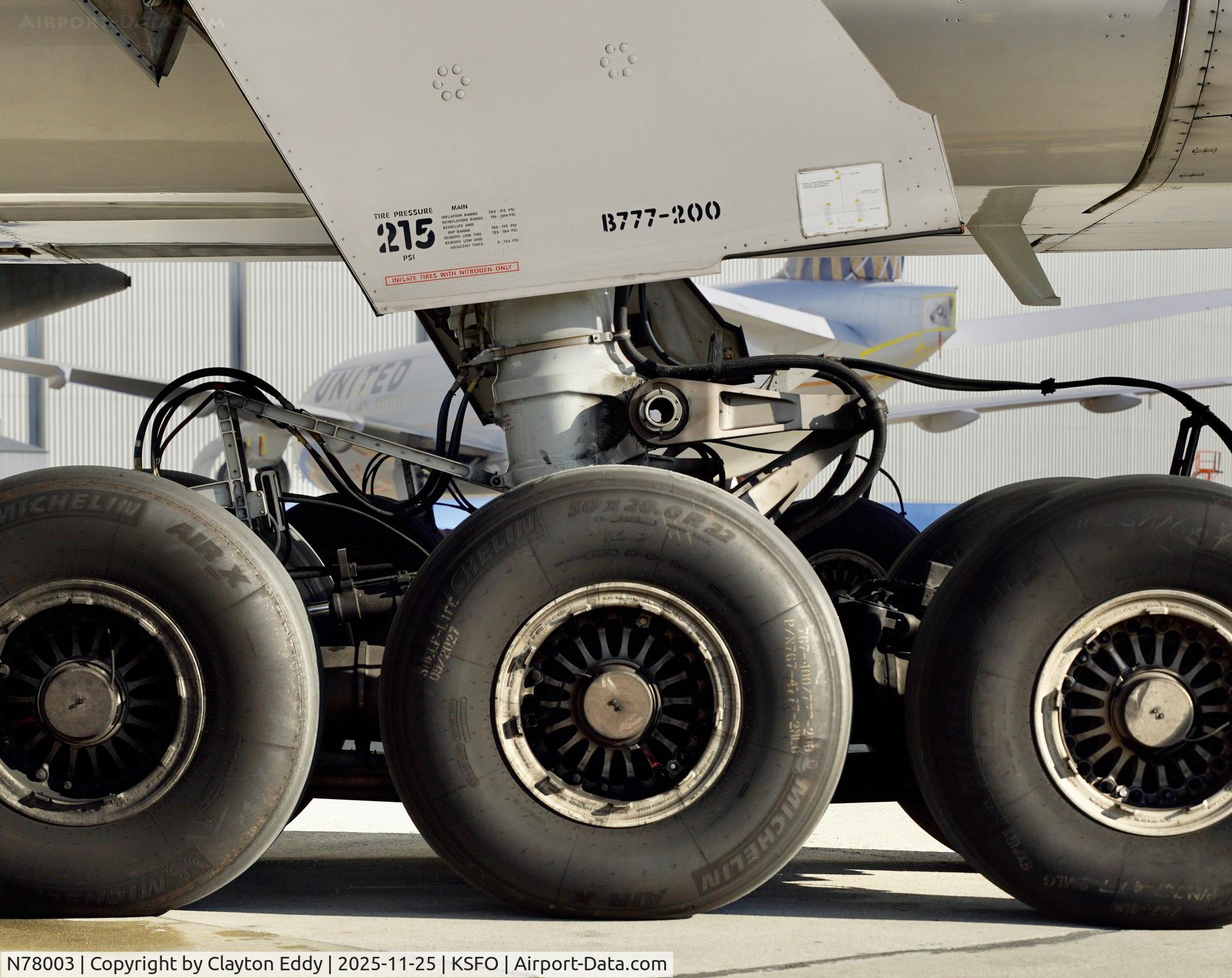 N78003, 1998 Boeing 777-224 C/N 27579, Left main gear SFO 2025