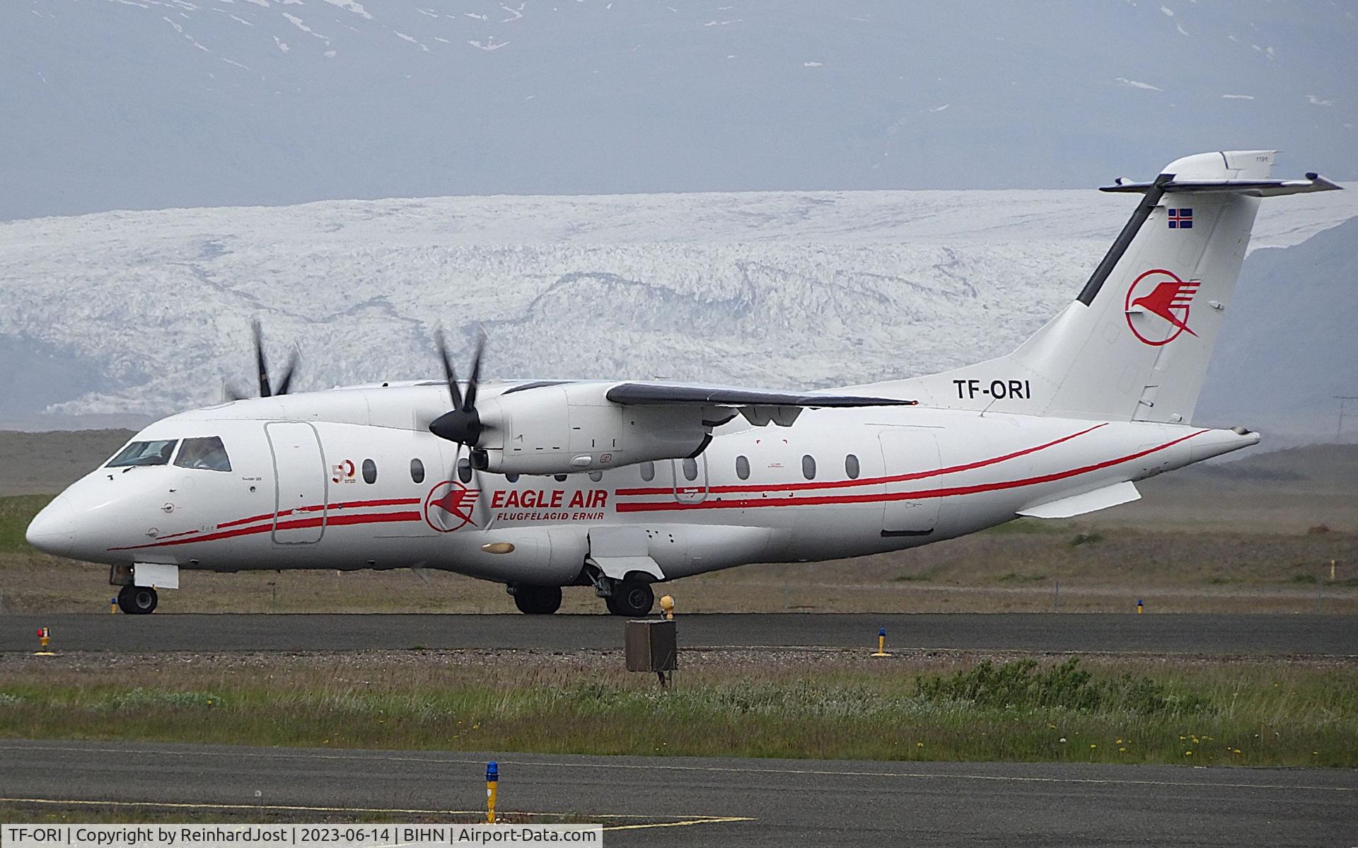 TF-ORI, 1998 Dornier 328-100 C/N 3088, TF-ORI with a 50-Years-sticker in front of a tongue of the Vatnajökul-glacier at Hornafjörður Airport, Iceland