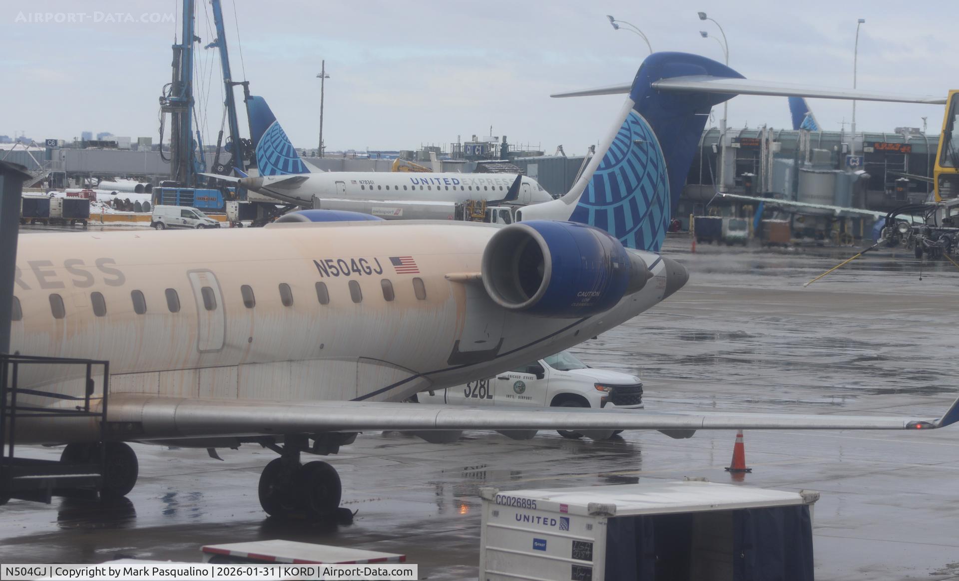 N504GJ, 2002 Bombardier CRJ-701 CL-600-2C10) Regional Jet C/N 10022, CL-600-2C10 Deiced at gate