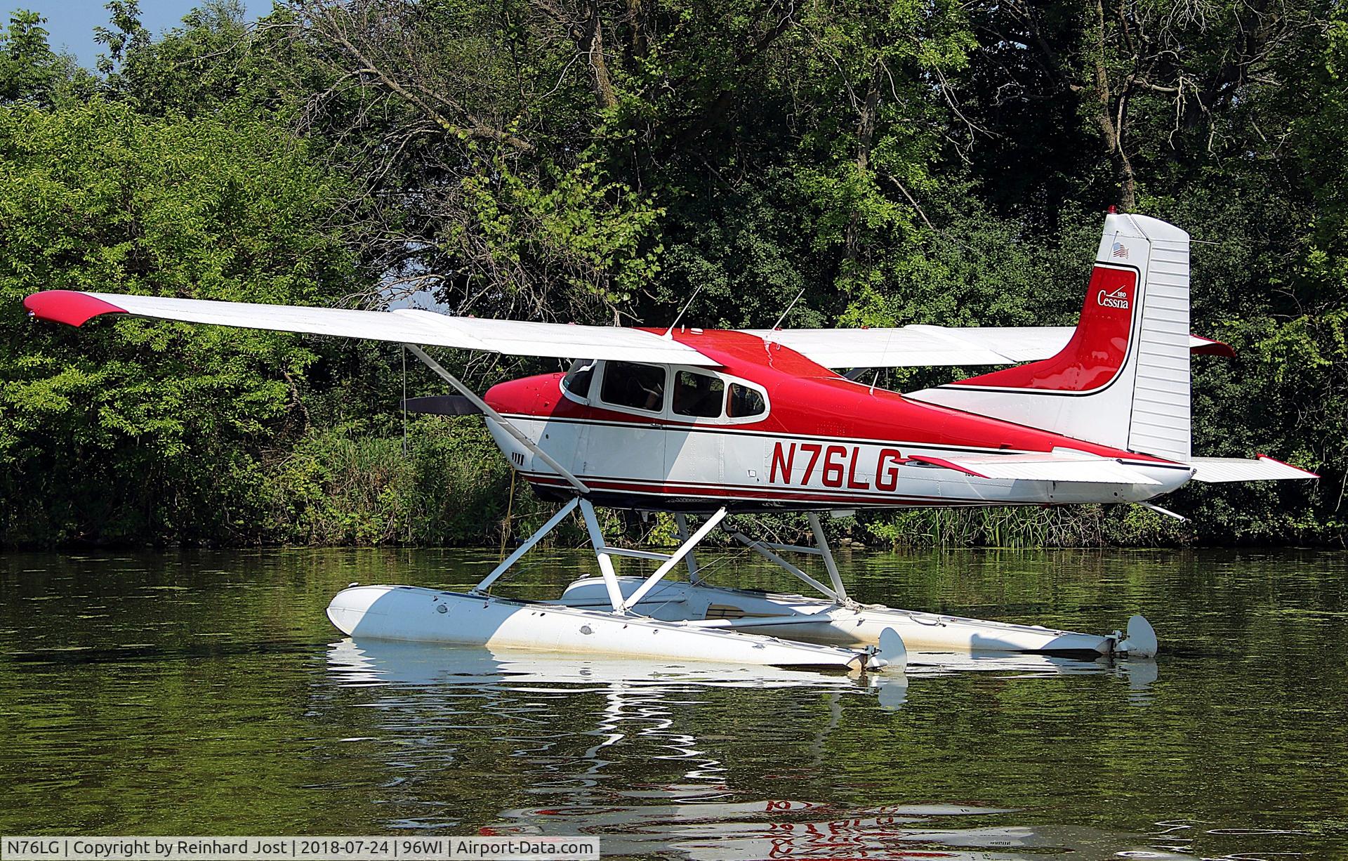 N76LG, 1976 Cessna 180J C/N 18052674, Skywagon in red on floats at Lake Winnebago suring AirVenture 2018