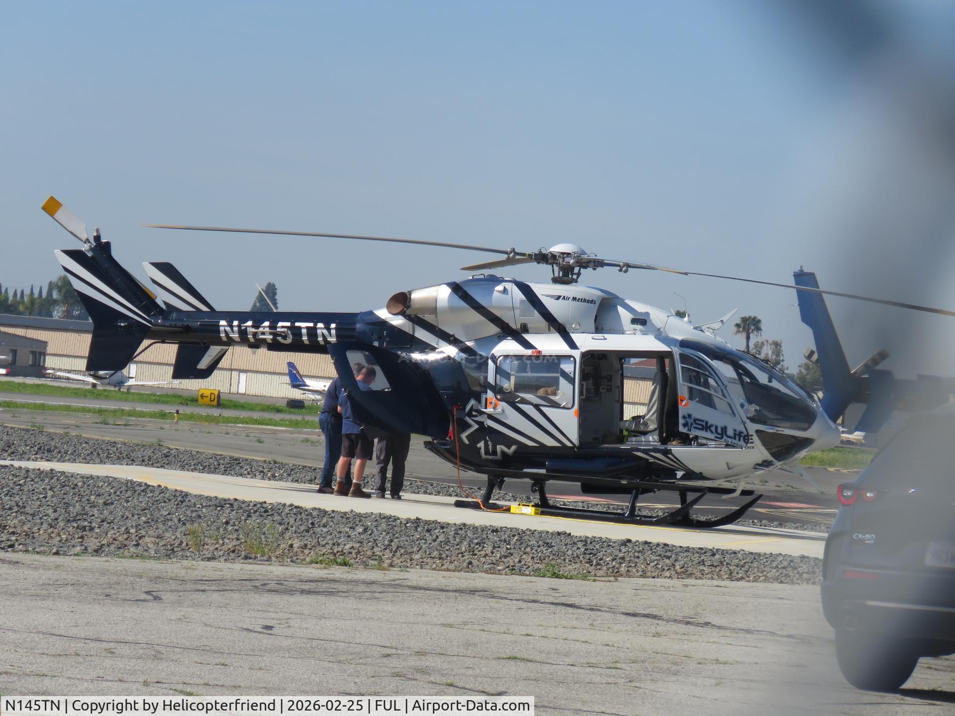 N145TN, 2006 Eurocopter-Kawasaki EC-145 (BK-117C-2) C/N 9092, Appear to be checking equipment