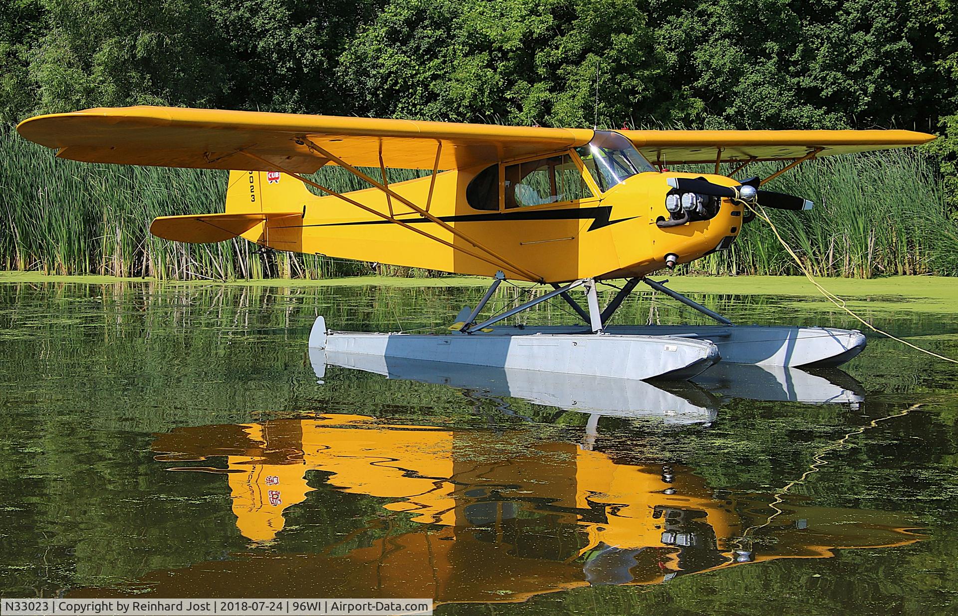 N33023, 1940 Piper J3C-65 Cub C/N 5782, 1940-build Cub at Lake Winnebago during AirVenture 2018