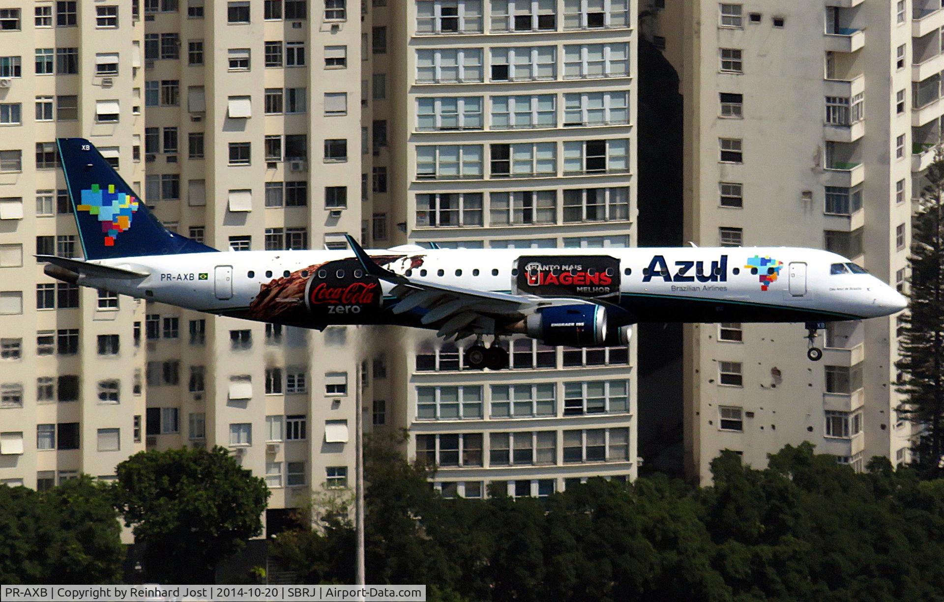 PR-AXB, 2011 Embraer 195AR (ERJ-190-200IGW) C/N 19000498, Rios Pao de Acucar offers nice views to aircraft on final for Santos Dumont RW02, as seen with this Azul Embraer with Coca Cola Zero advertising
