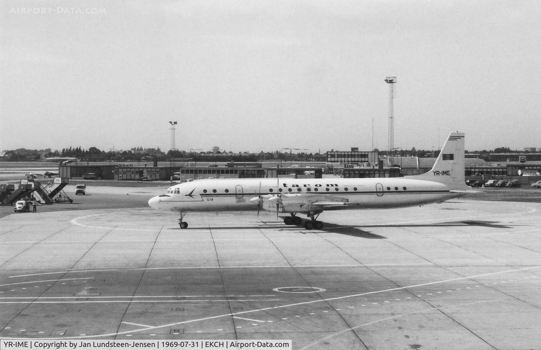 YR-IME, 1963 Ilyshun Il-18V Coot C/N 183006205, Ilyushin Il-18V YR-IME of the Romanian airline Tarom being marshalled to the gate. The marshaller beside the Volkswagen 'Follow Me' car seen to the left.