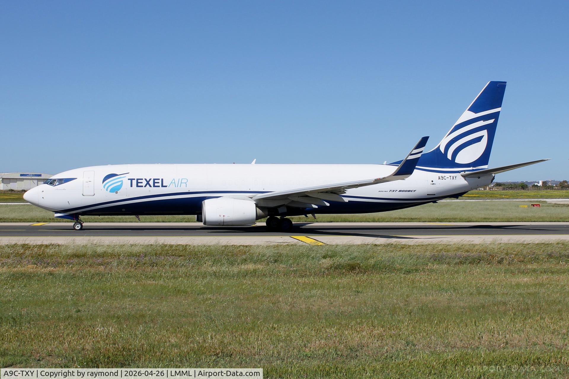 A9C-TXY, Boeing 737-8Q8(BCF) C/N 29374, Texel Air Boeing 737-8Q8(BCF) reg A9C-TXY taxiing out for departure from Malta.