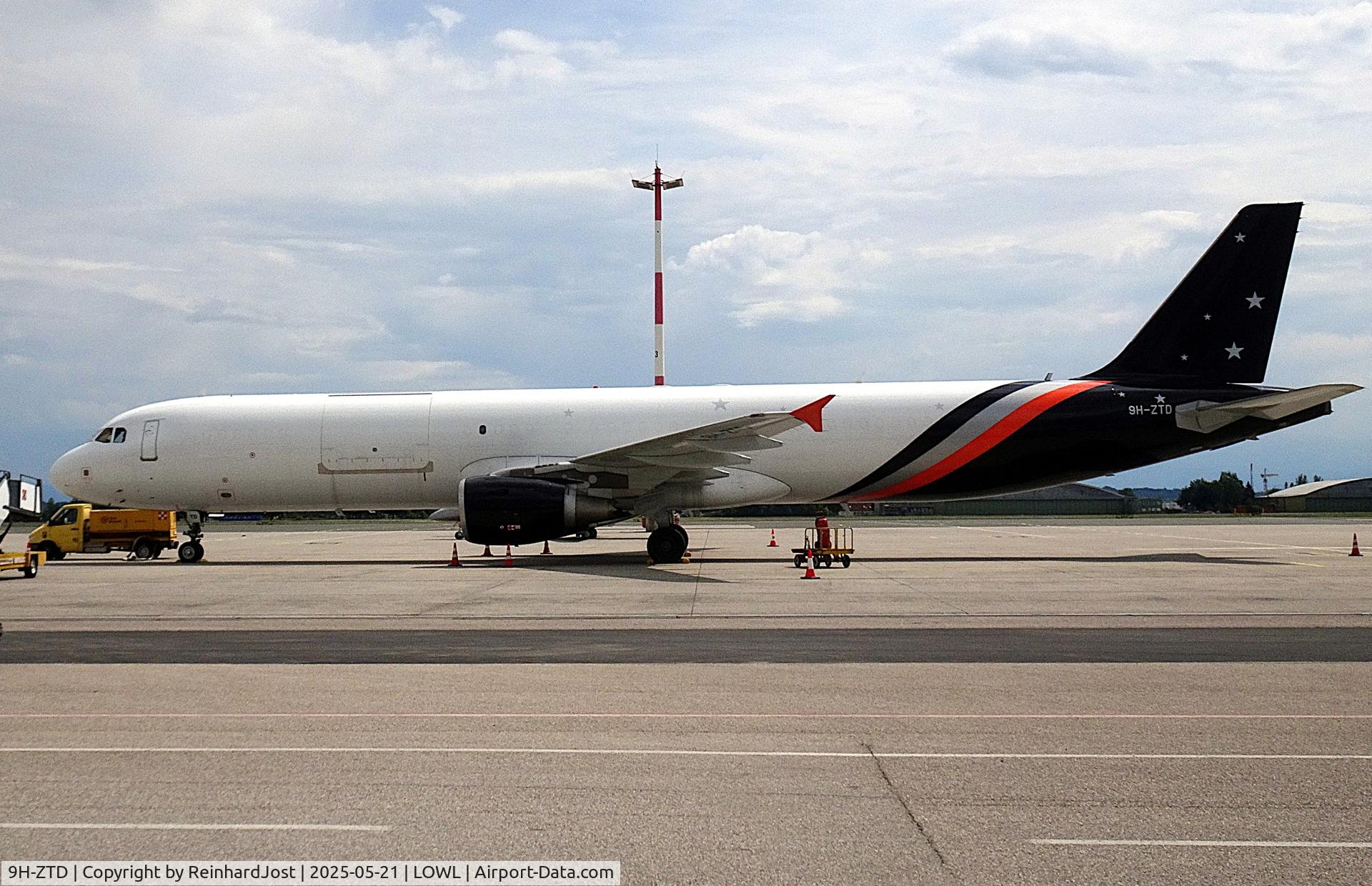 9H-ZTD, 2003 Airbus A321-211, c/n 2060, After conversion to A320-211P2F  with a big cargo door in Titan colors but without titles during a freigth service at Linz, Austria